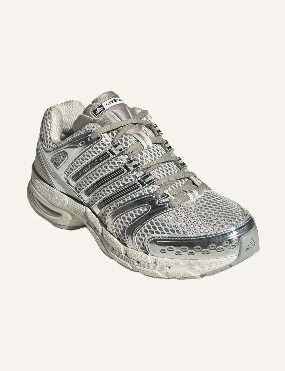 adidas Originals Adistar Control 5 sneakers in Off White with silver metallic overlays angled