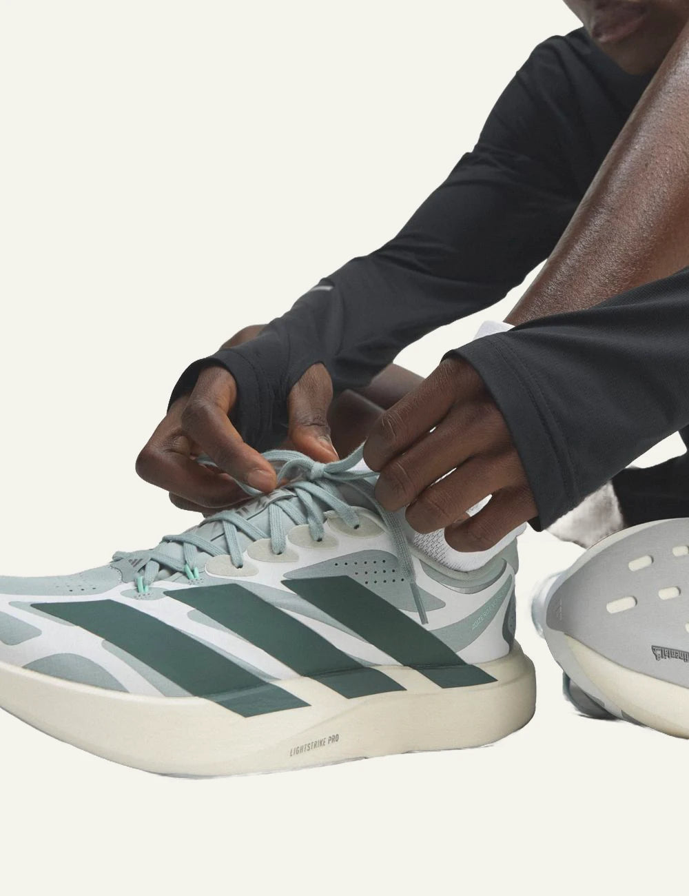 adidas Originals Adizero Evo SL EXO running shoes in Wonder Sage with Legend Ivy details model