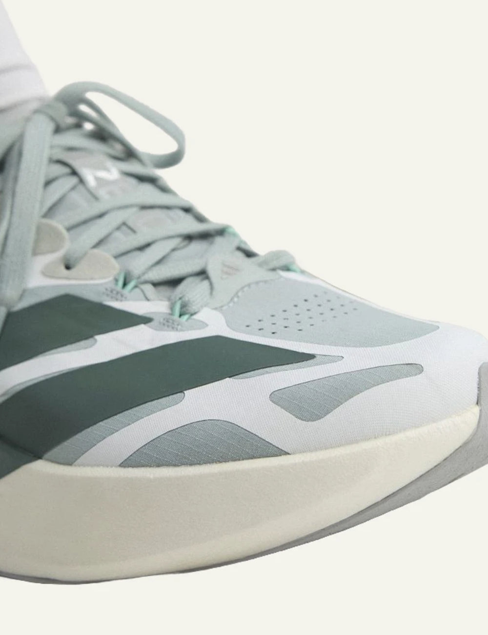 adidas Originals Adizero Evo SL EXO running shoes in Wonder Sage with Legend Ivy angled