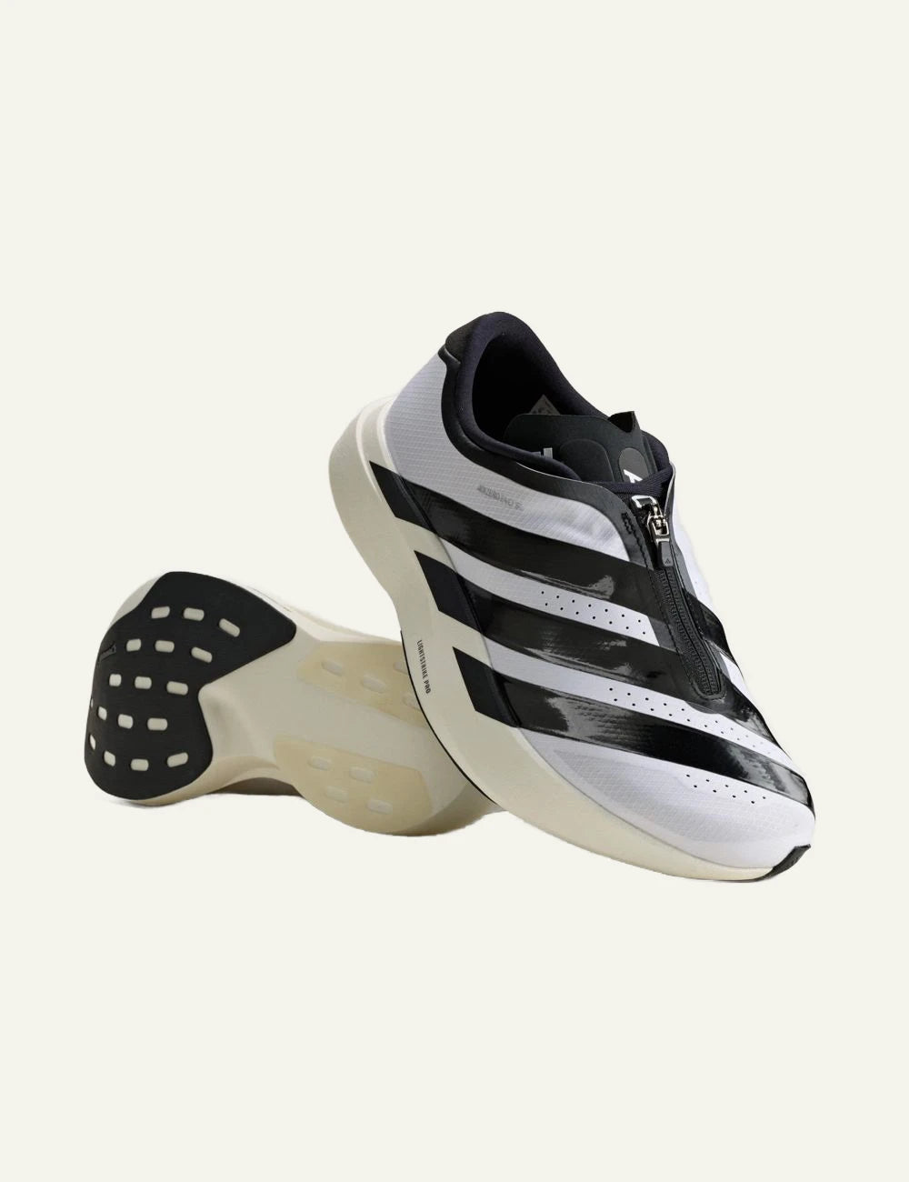 Women's adidas Adizero EVO SL Zip running shoes in white and black with LIGHTSTRIKE PRO midsole and zip closure front