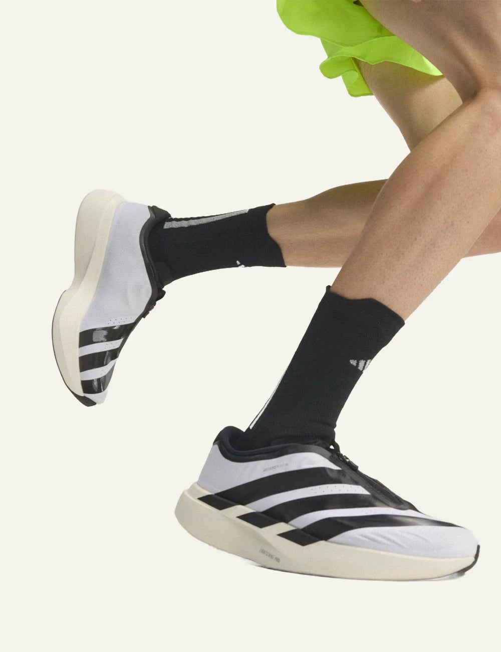 Women's adidas Adizero EVO SL Zip running shoes in white and black with LIGHTSTRIKE PRO midsole and zip closure model