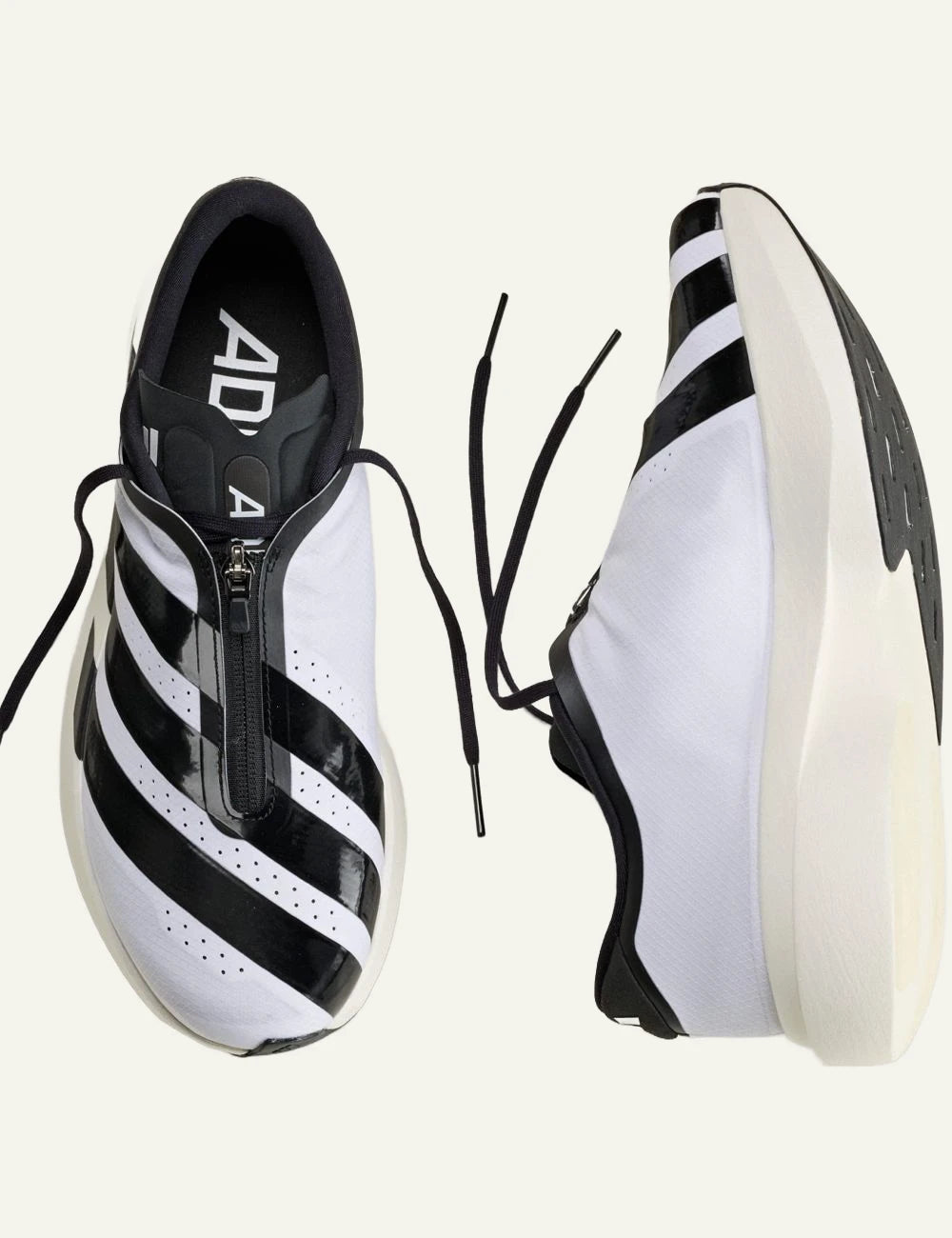 Women's adidas Adizero EVO SL Zip running shoes in white and black with LIGHTSTRIKE PRO midsole and zip closure top