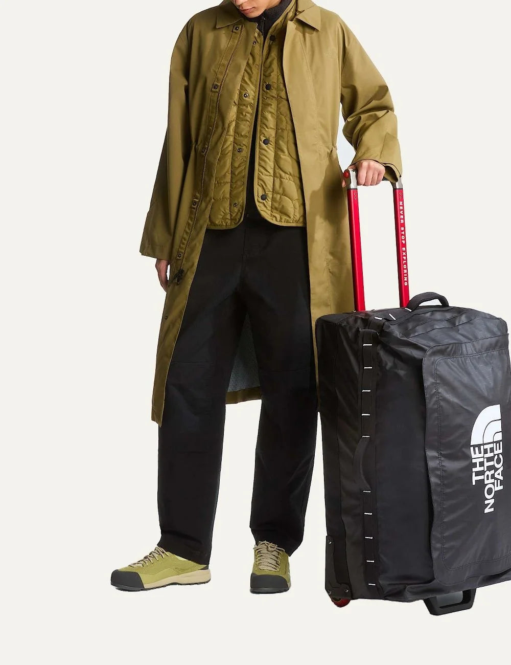 The North Face Base Camp Voyager Roller 29 black rolling travel suitcase with white logo, red telescopic handle and two wheels model