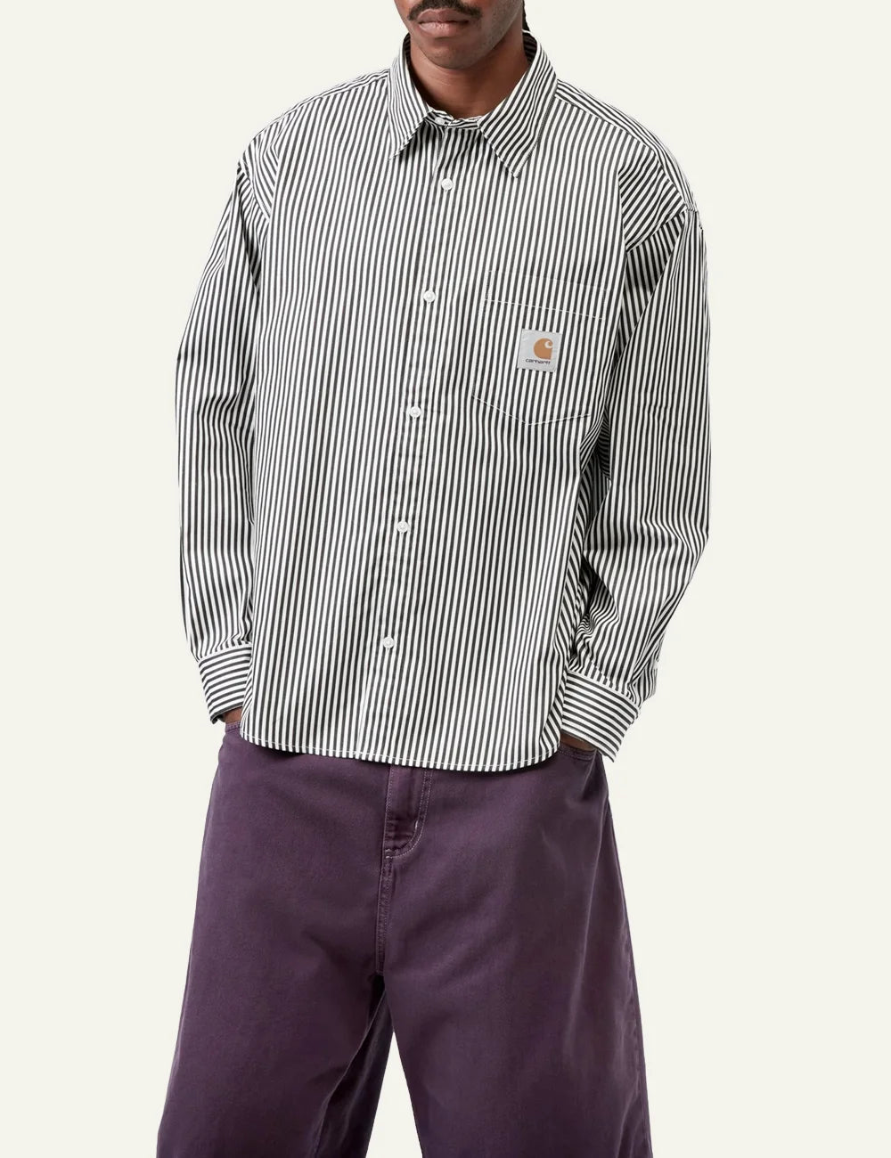 Model wearing Carhartt WIP Daldry Shirt black/wax stripe, relaxed fit cotton shirt with chest logo patch