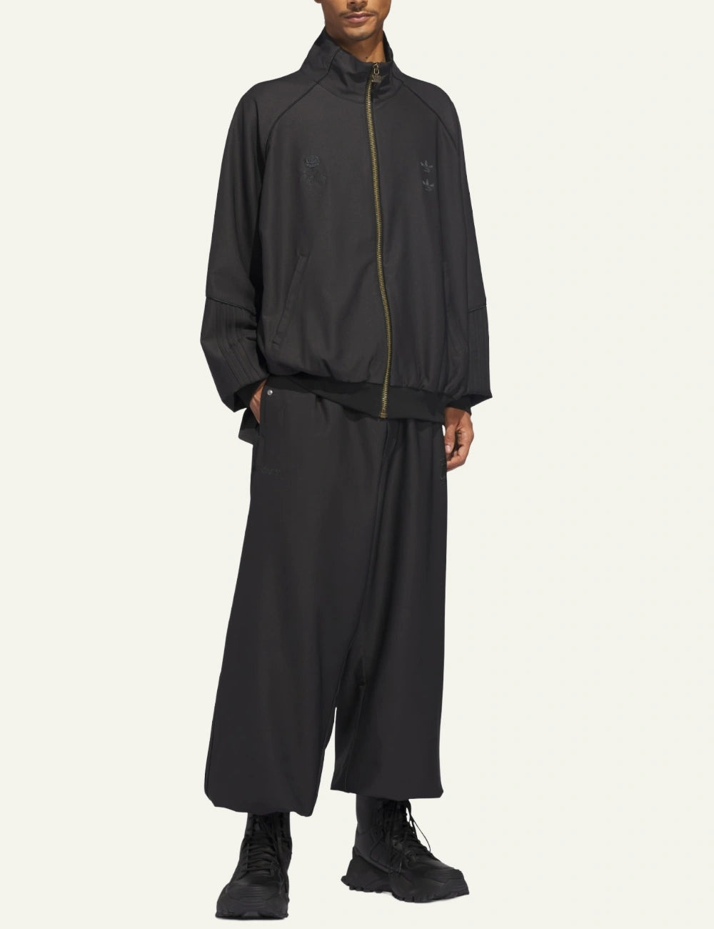 Full body look featuring Adidas x Willy Chavarria twill track pants styled with matching jacket.