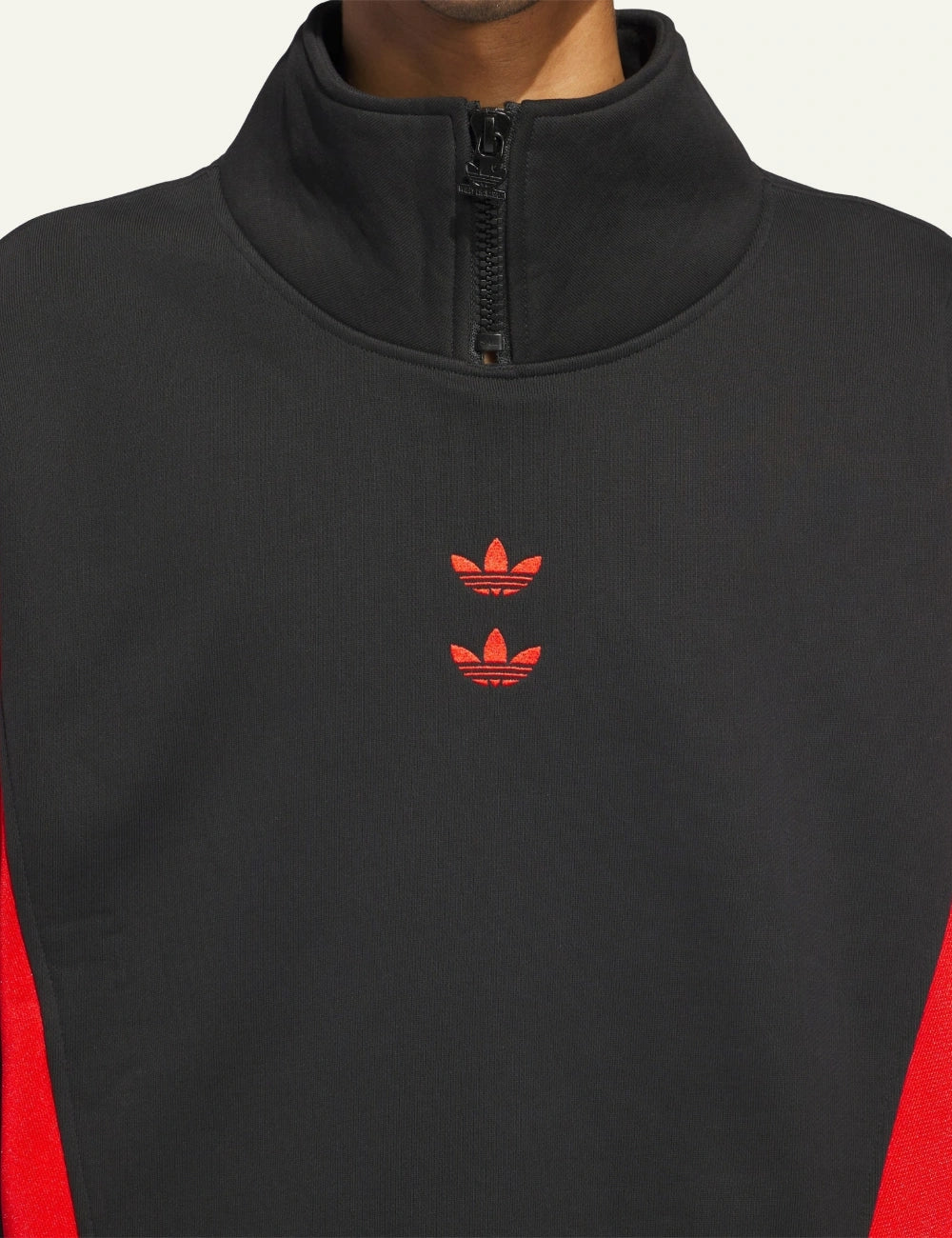 Close-up embroidered double Trefoil logo on Watsonville mockneck jumper black/red.