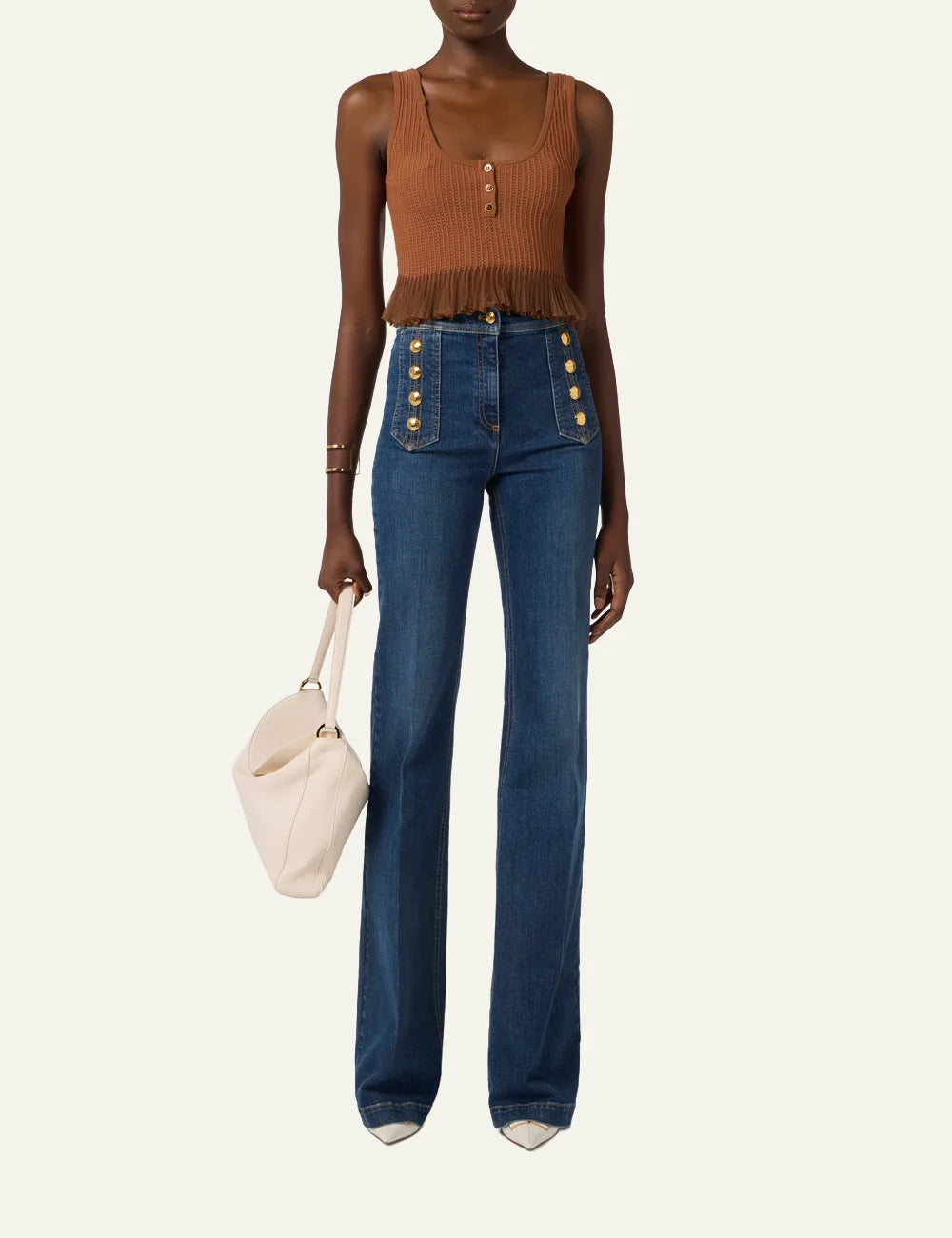 Model wearing Elisabetta Franchi high-waist palazzo jeans με gold buttons, elegant fitted denim silhouette.