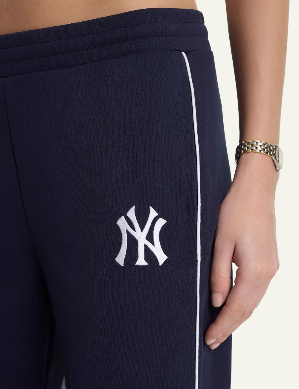 Sporty and Rich NY logo track pants navy detail