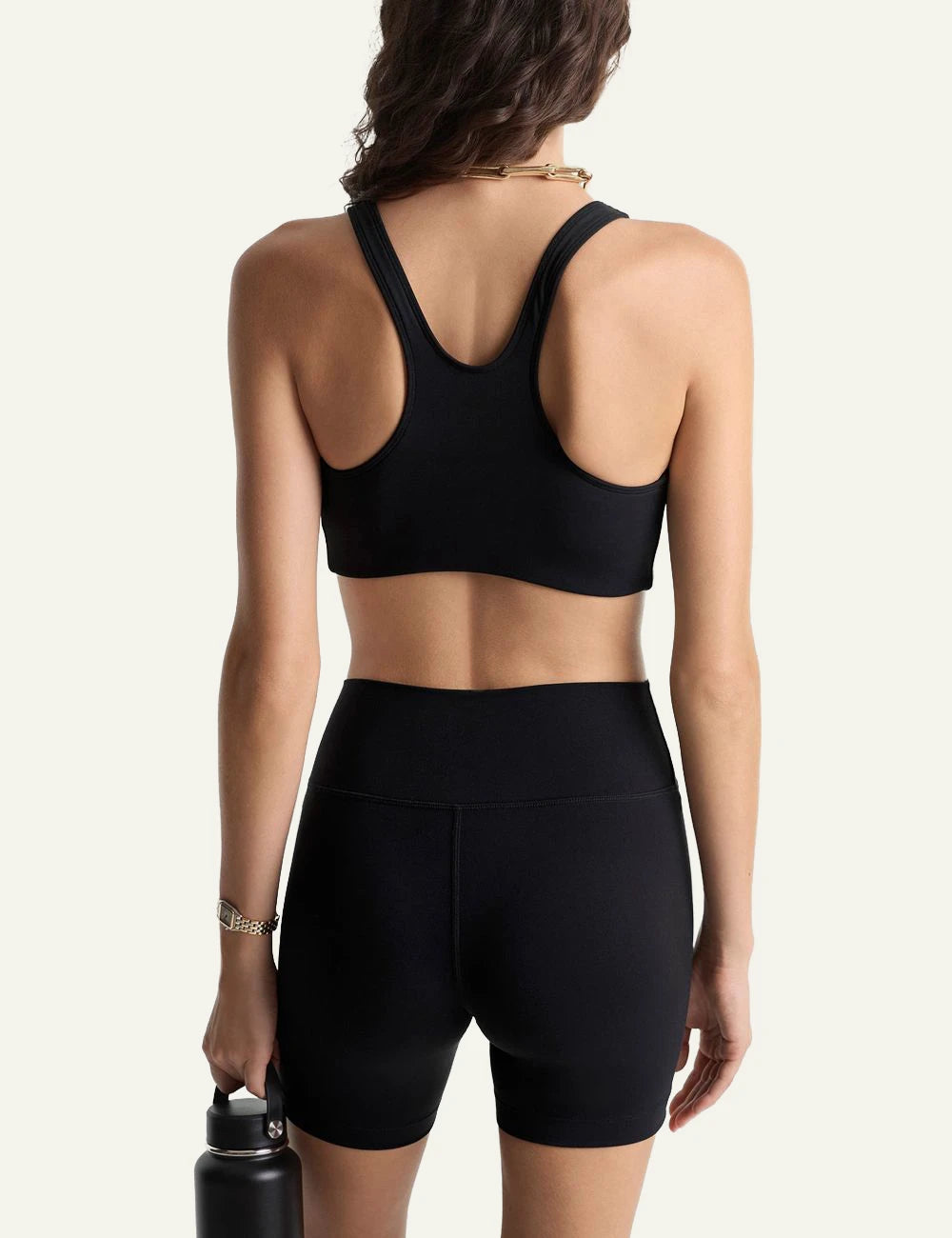 Sporty and Rich black sports bra logo back view