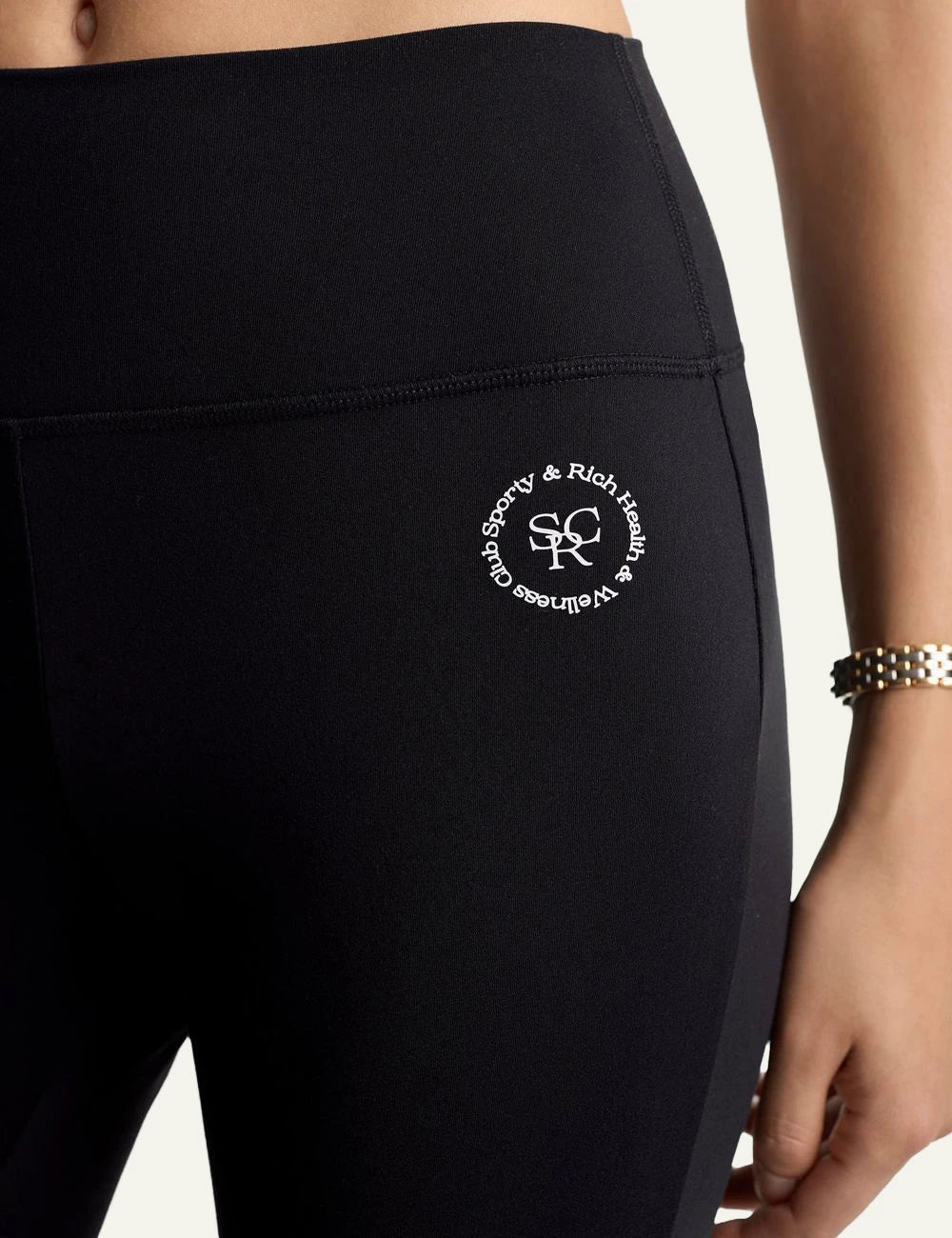 Sporty and Rich black flared leggings front detail view