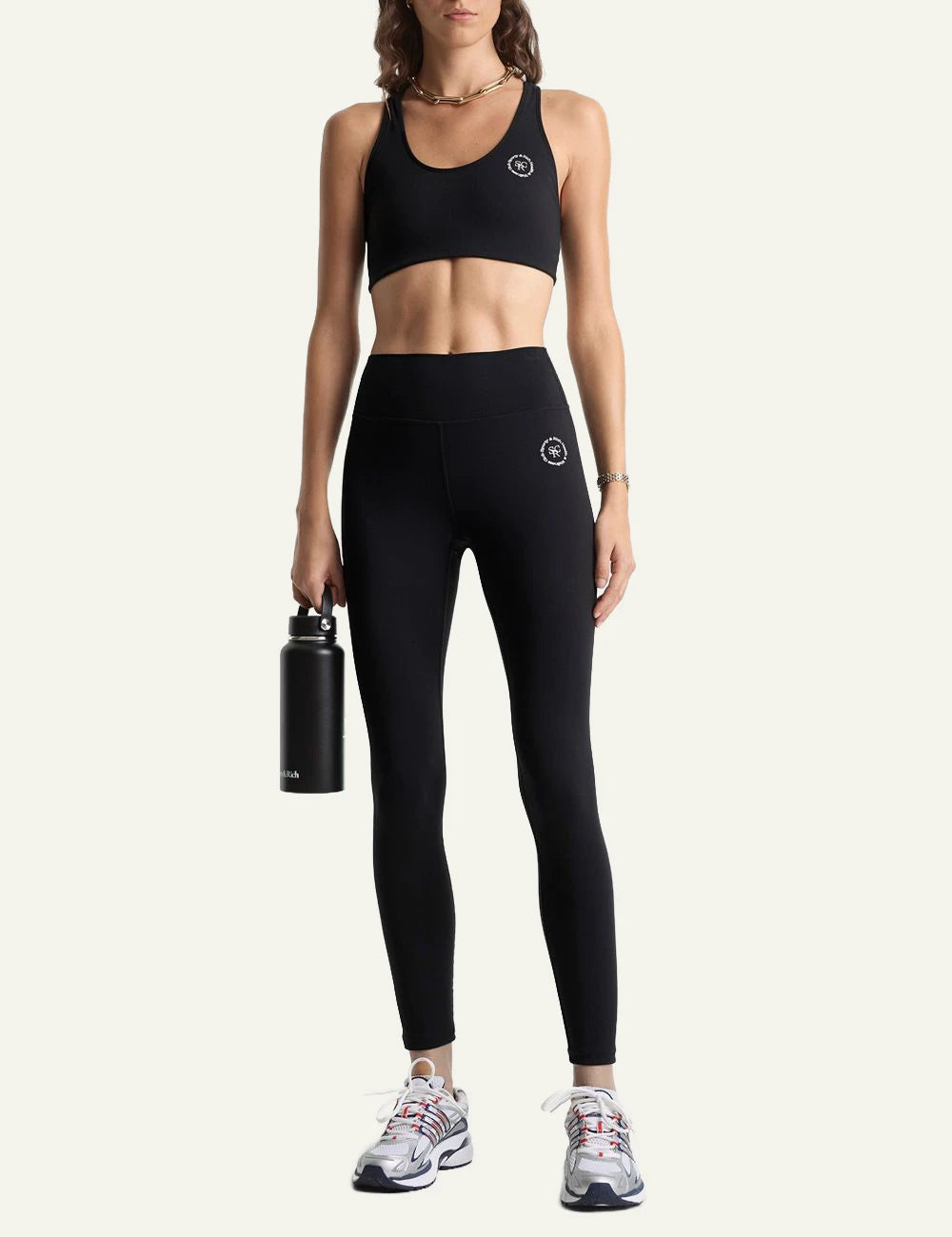 Sporty and Rich black ankle leggings front model view