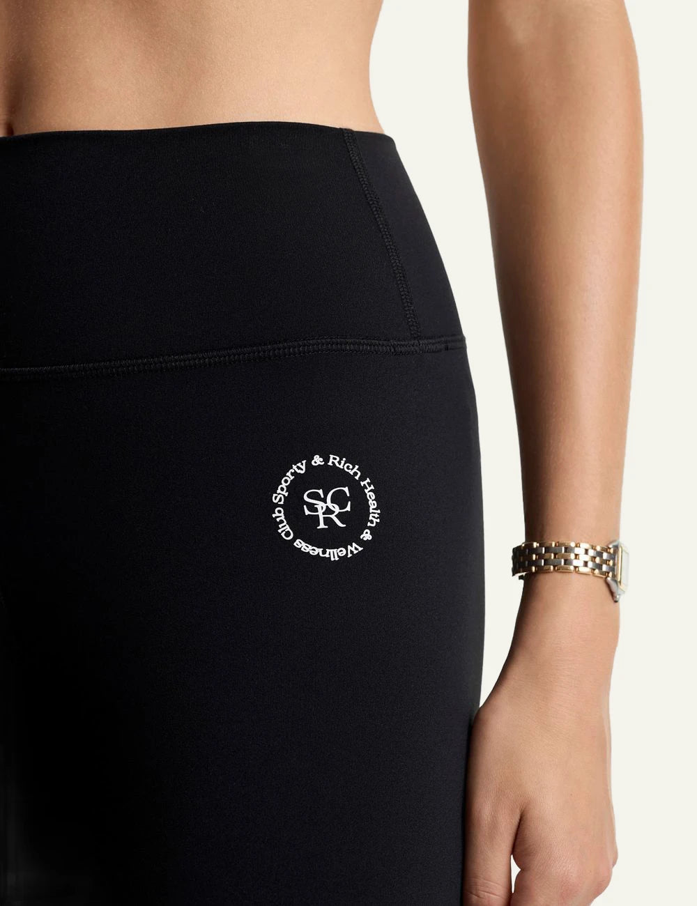 Sporty and Rich black ankle leggings front detail view