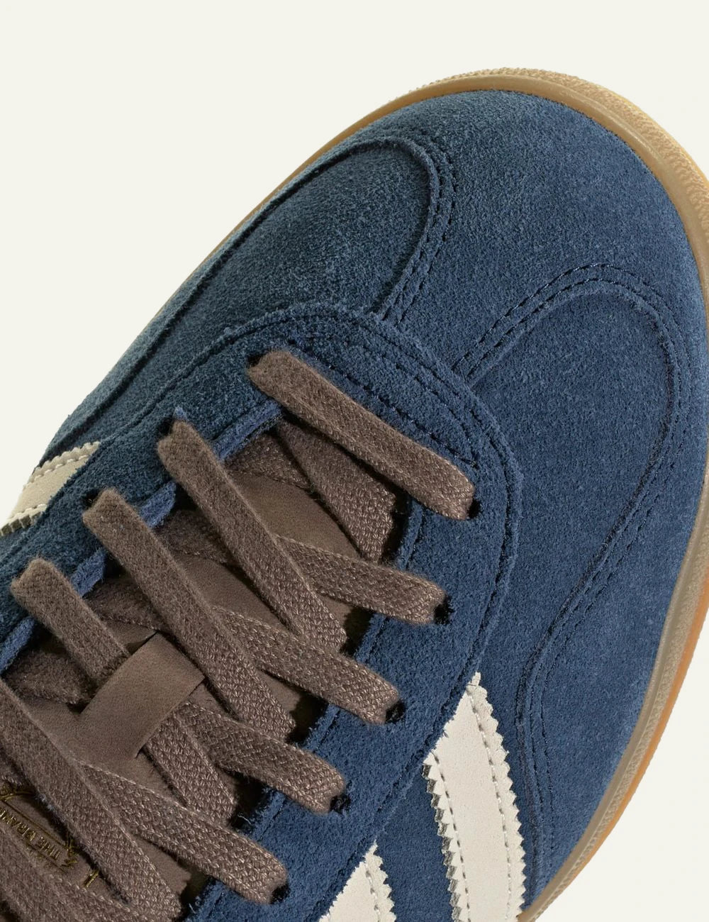 Men's adidas Originals Gazelle Indoor suede sneakers in blue, off white and brown angled