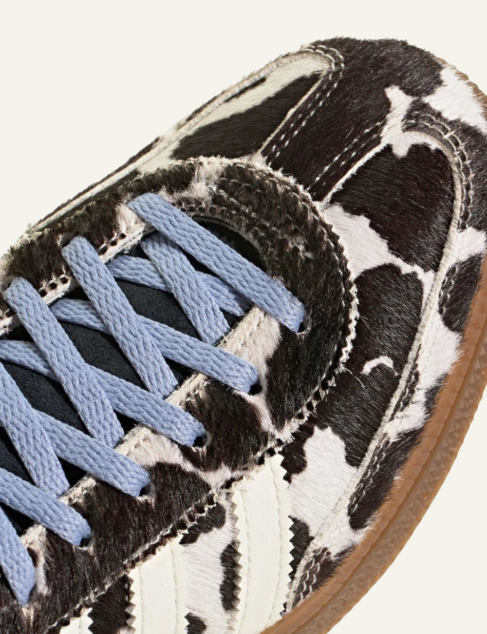 Women's Adidas Originals Handball Spezial sneakers in black and off white animal print with gum sole angled