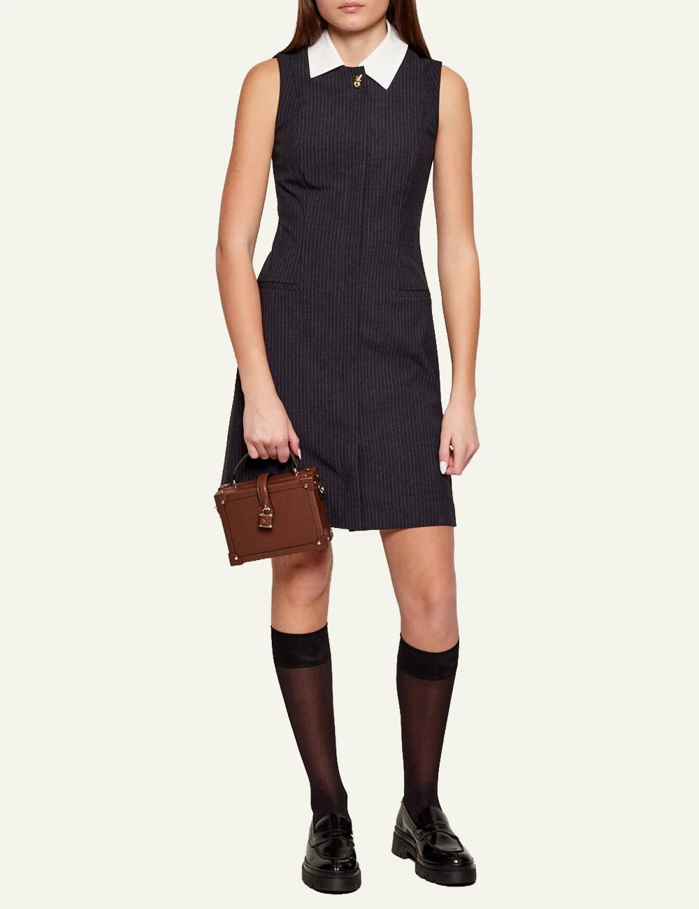 Karl Lagerfeld brown trunk bag worn crossbody on model