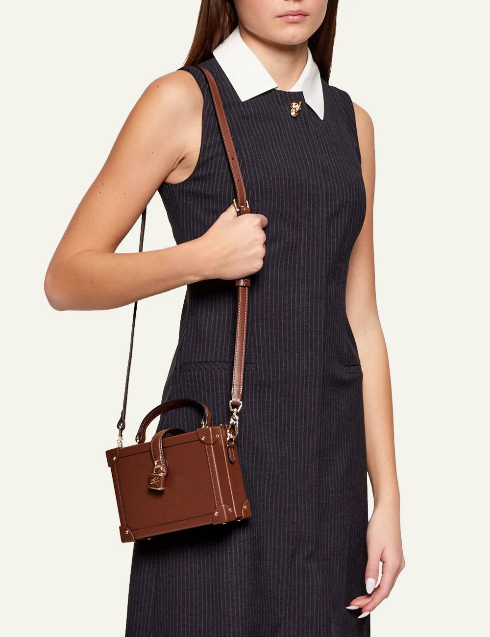 Karl Lagerfeld brown trunk bag worn crossbody side view on model