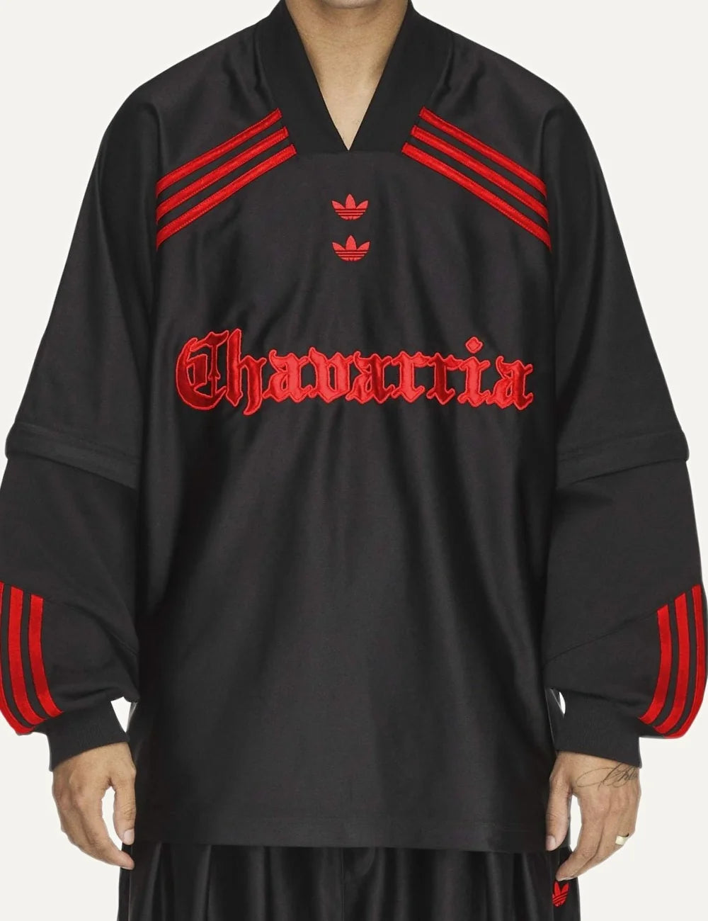 Men's adidas x Willy Chavarria black long sleeve jersey with red stripes and embroidered logos model