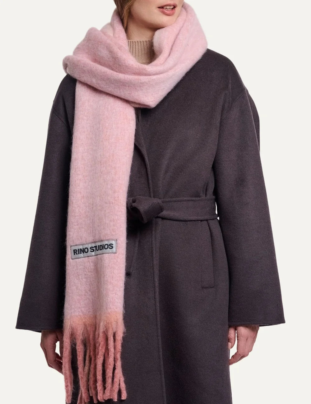 Rino Pelle women's soft pink oversized fluffy scarf with long fringes and Rino Studios logo patch.