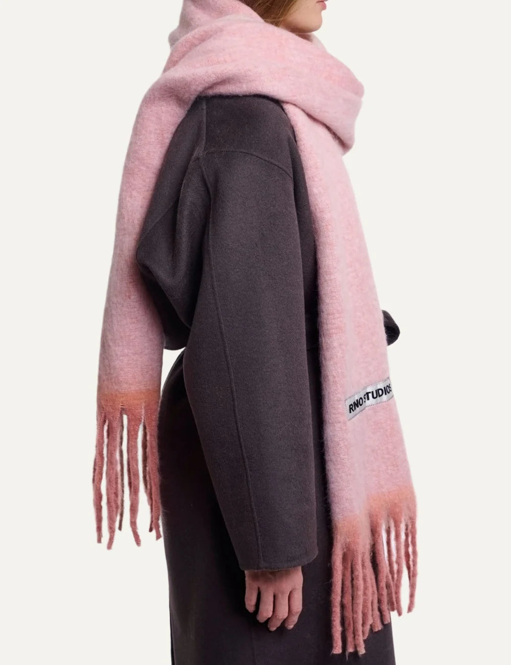 Rino Pelle women's soft pink oversized fluffy scarf with long fringes and Rino Studios logo patch side