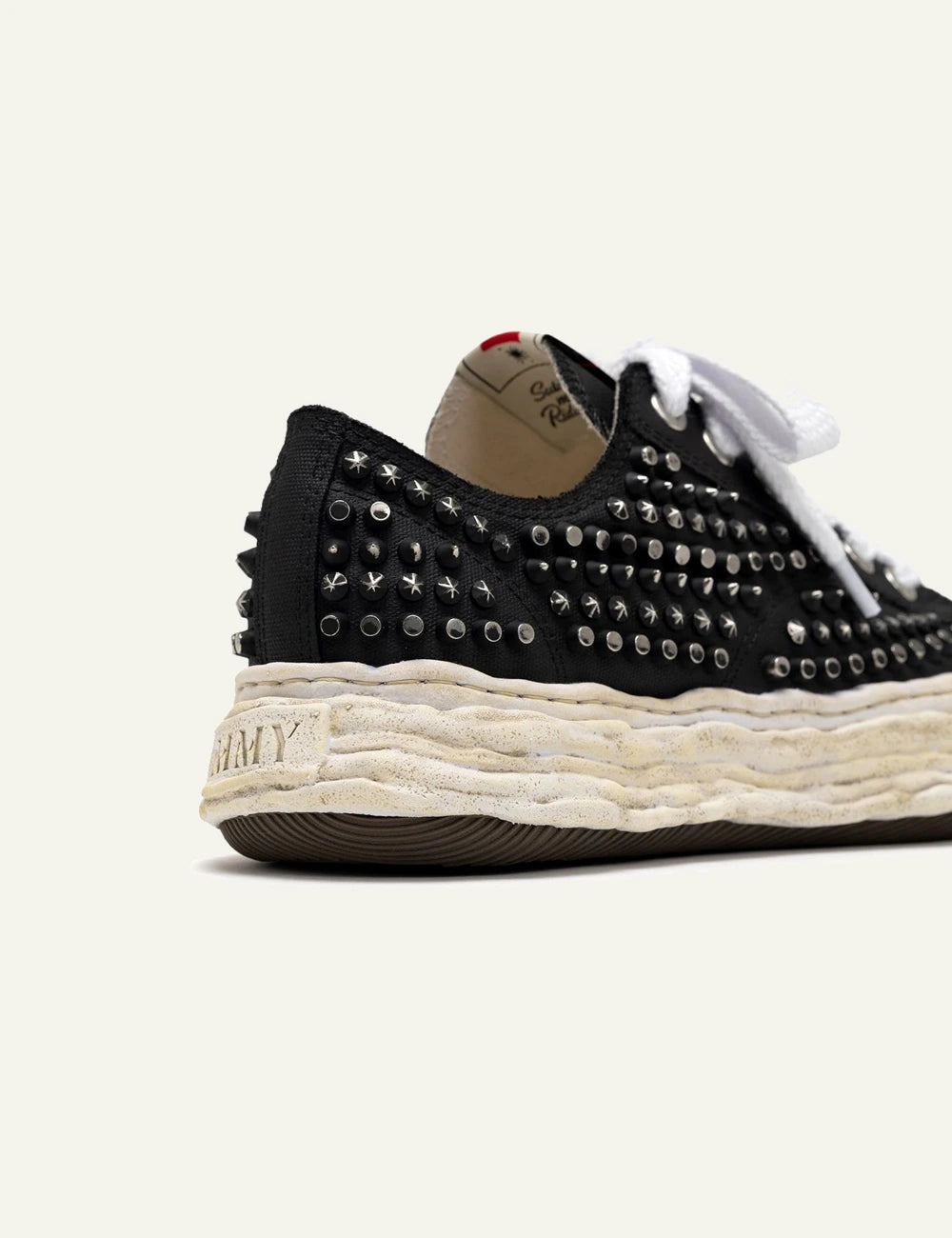 Upper detail Maison Mihara Yasuhiro Peterson23 studded canvas, metal rivets design