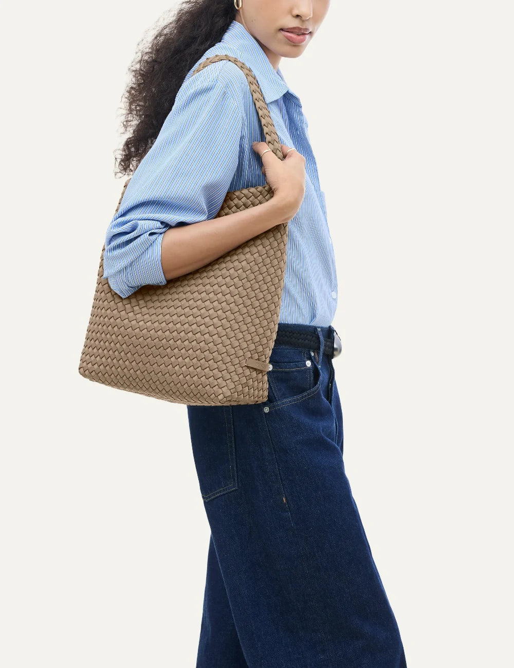 Women's Naghedi Nomad Medium Hobo bag in Cashmere taupe handwoven neoprene with wide shoulder strap on model