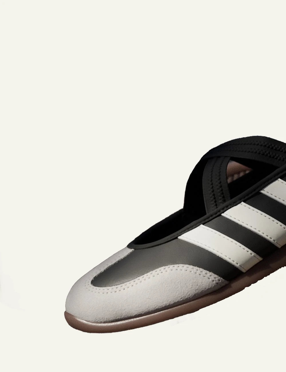 Adidas Originals leather sneakers core black core white gum strap detail angled view