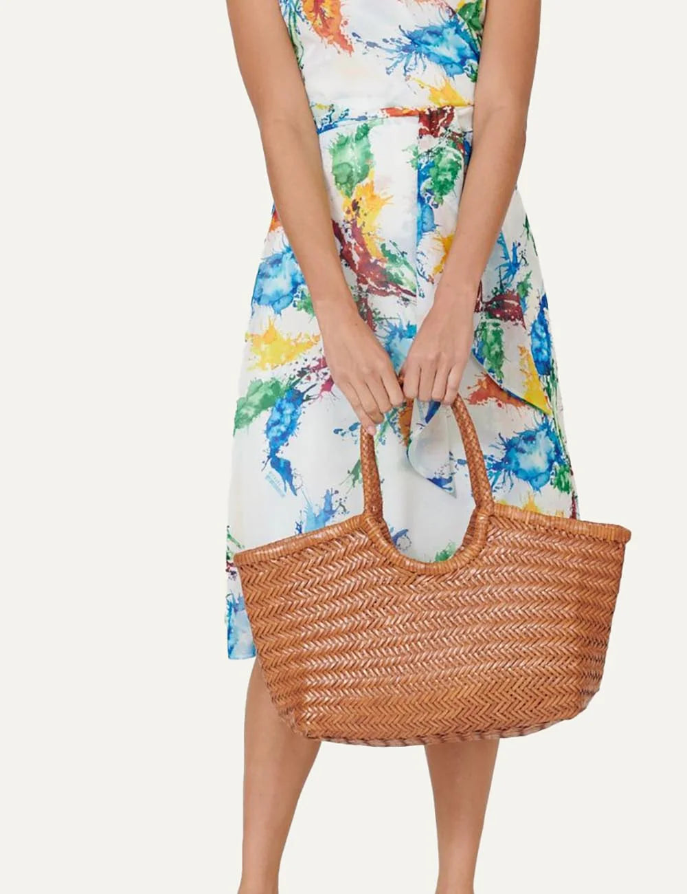 Dragon Diffusion woven leather tote bag in tan with braided handles on model