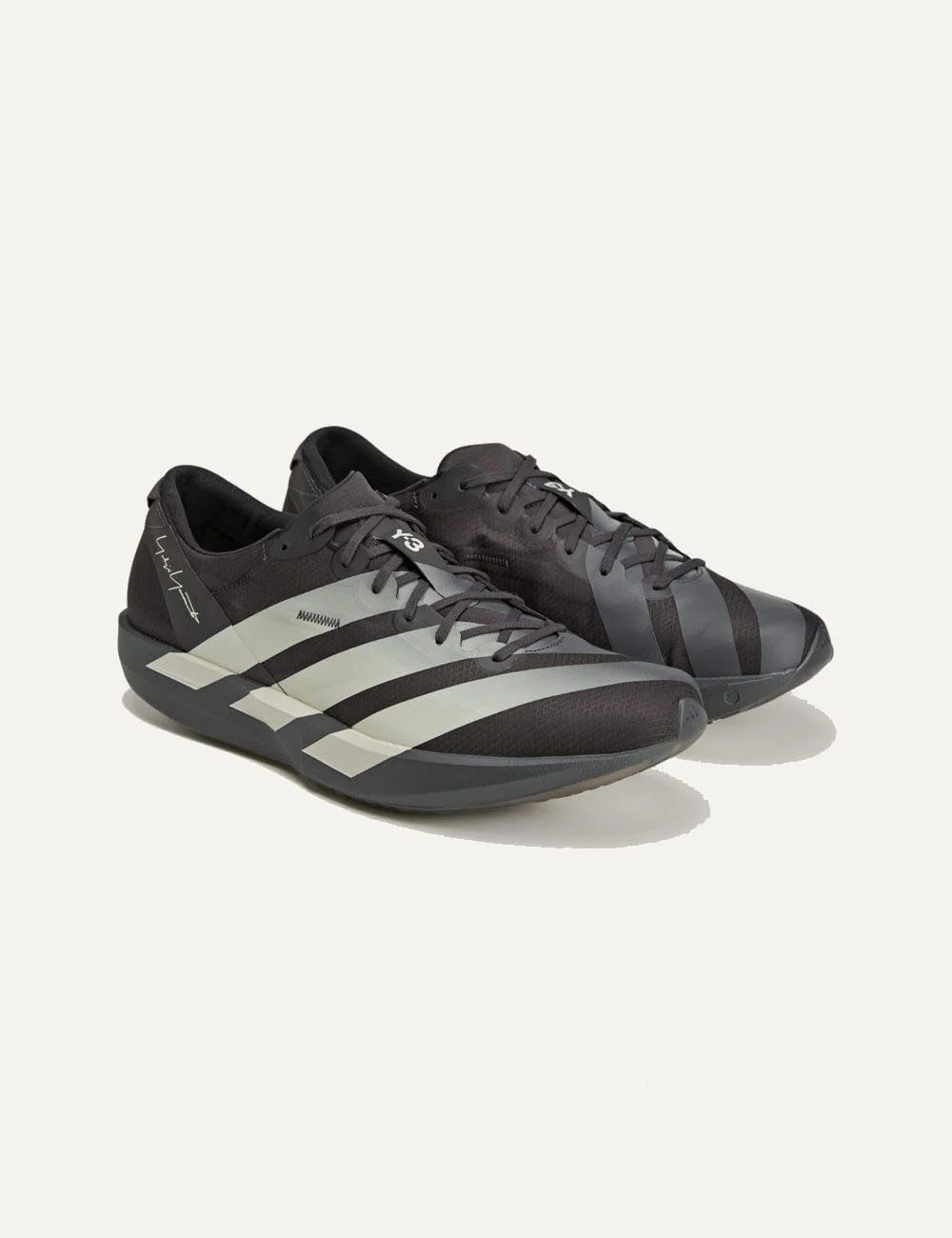 Y-3 Adios 9 sneaker black me off white stripes angled view