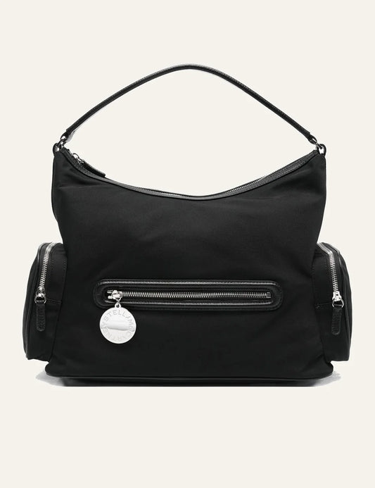 “Stella McCartney Dartmoor shoulder bag σε black nylon με front zip pocket και signature round logo charm.”