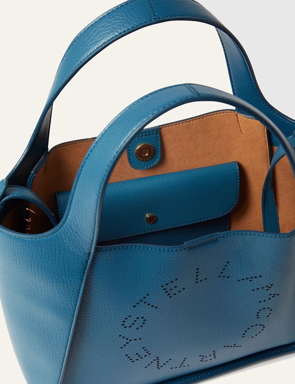 Stella McCartney vegan leather tote upper view με perforated logo detail