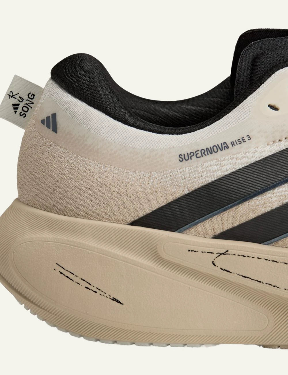 Adidas Supernova Rise 3 sneaker se beige me black stripes side detail view