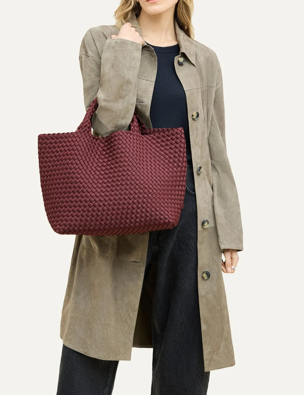 Women's Naghedi St. Barths Medium Tote in Bordeaux burgundy handwoven neoprene with woven handles on model