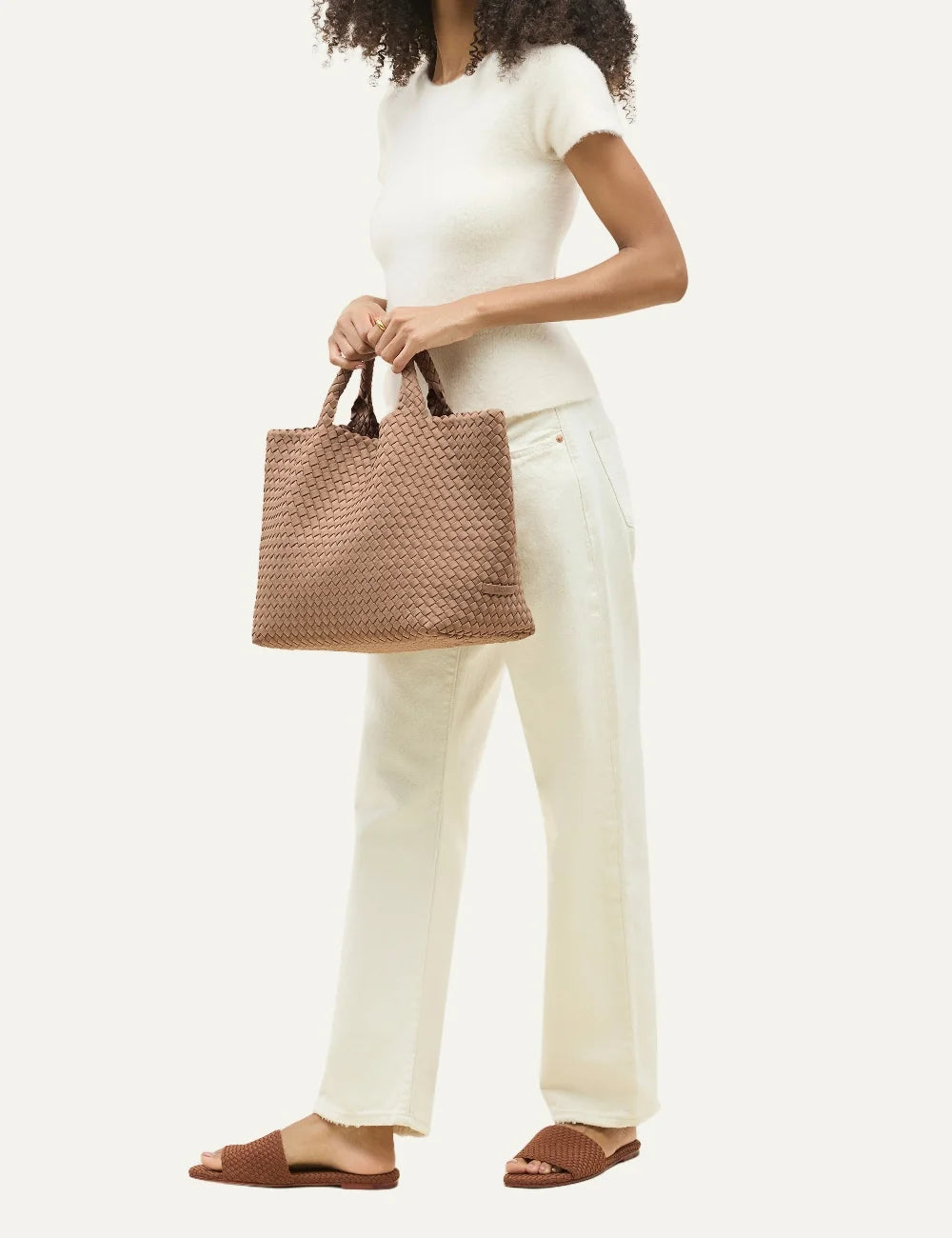  Women's Naghedi St. Barths Medium Tote in light mocha handwoven neoprene with woven handles on model