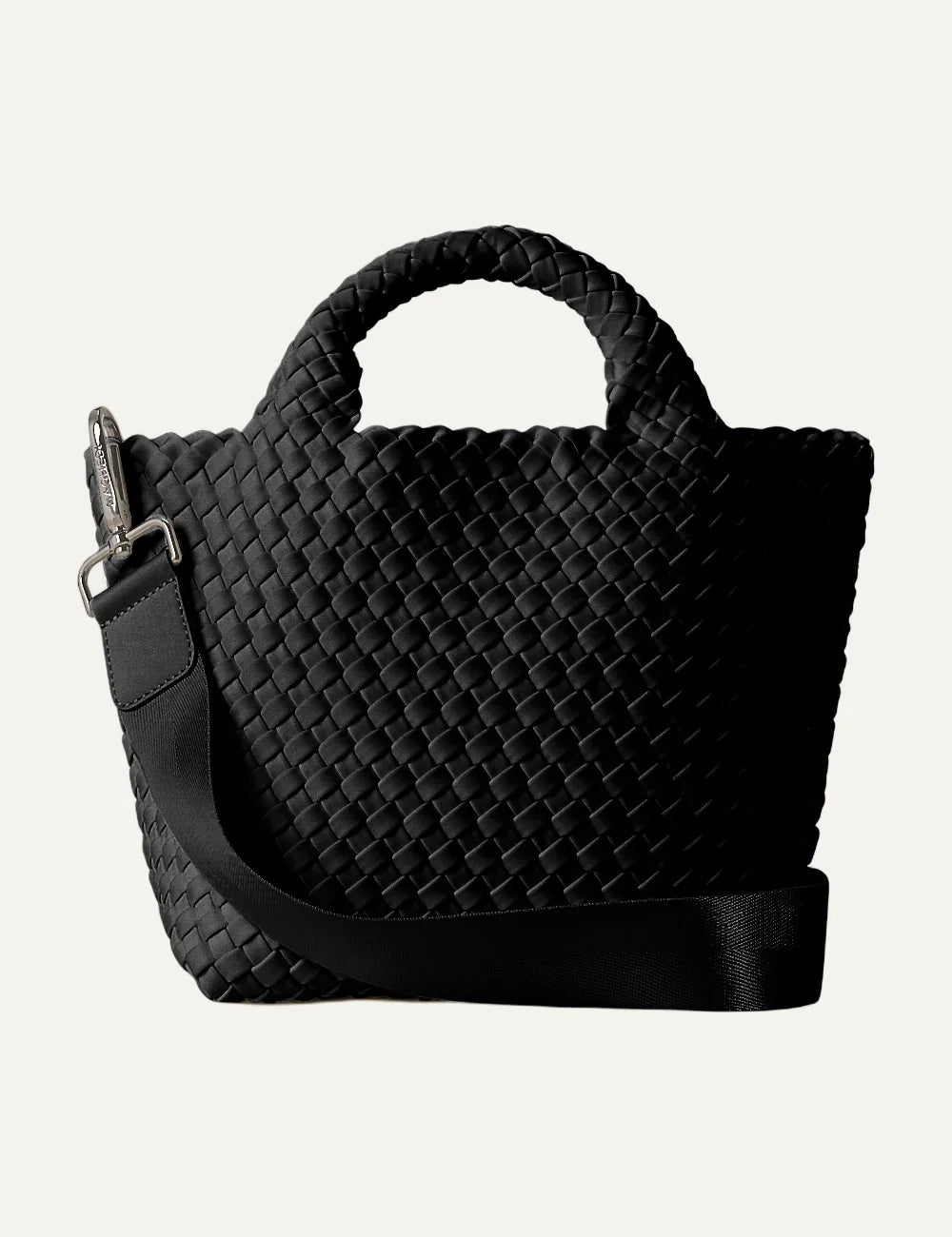 Women's Naghedi St. Barths Small Tote in black handwoven neoprene with top handles and adjustable crossbody strap front view