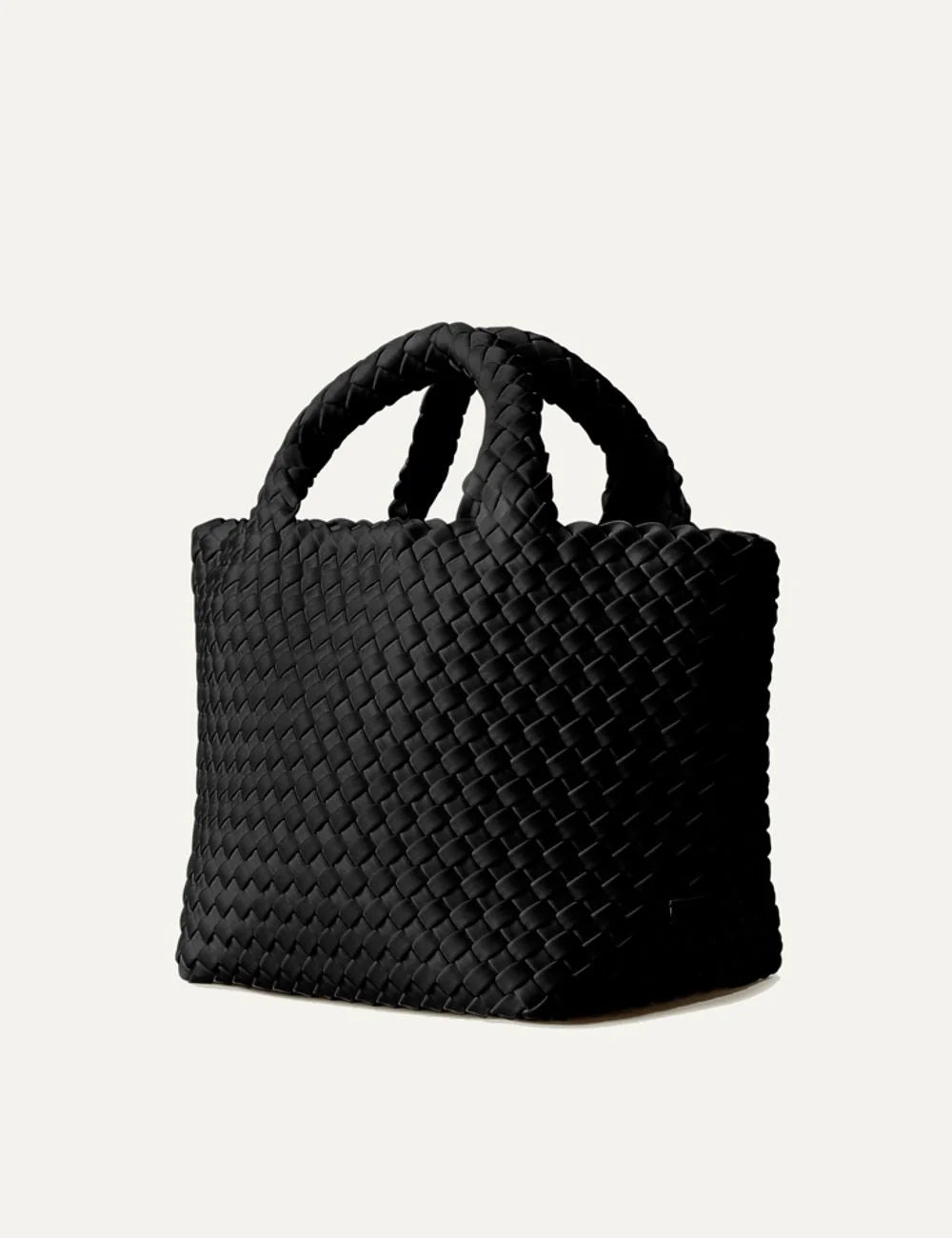 Women's Naghedi St. Barths Small Tote in black handwoven neoprene with top handles and adjustable crossbody strap side view