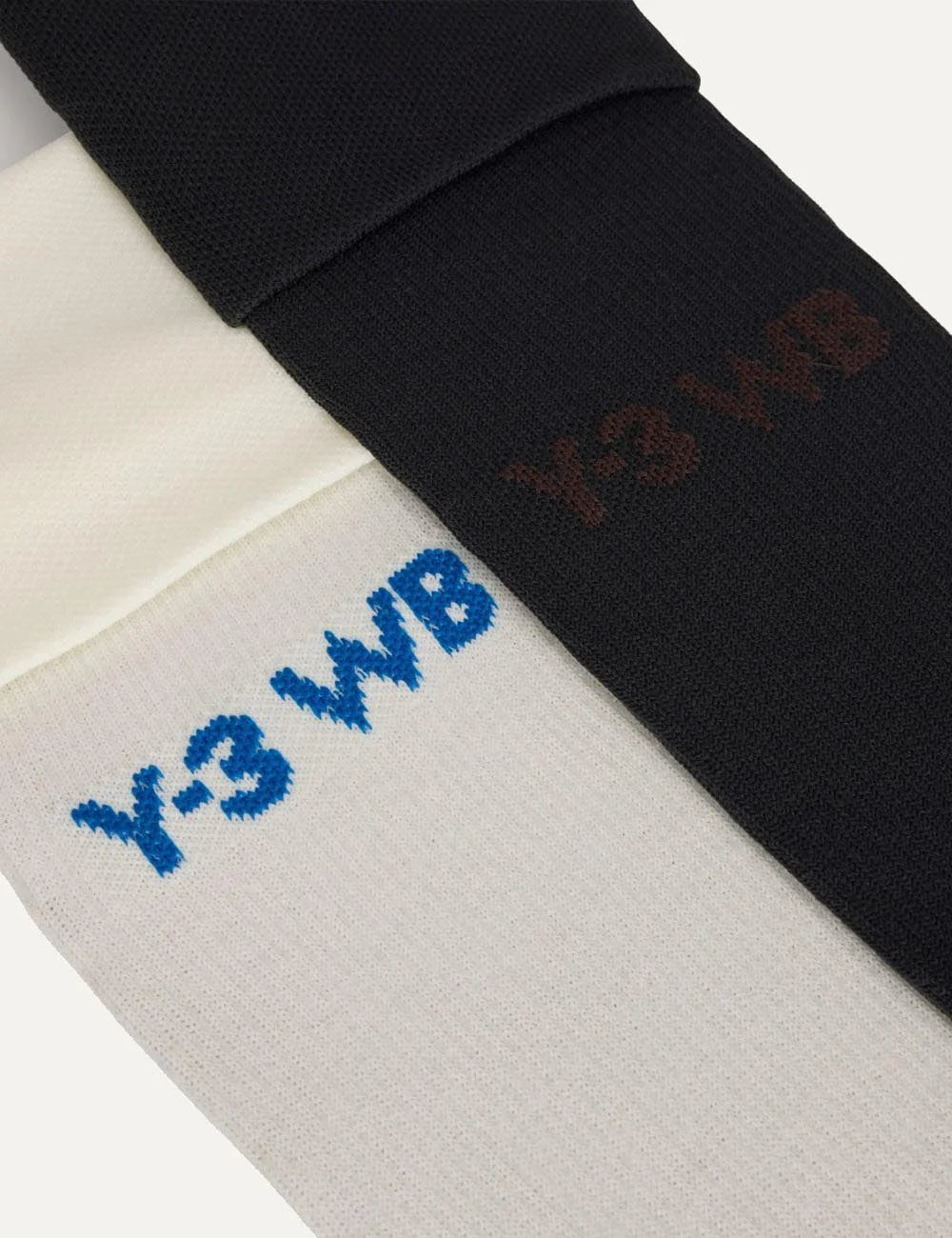 Y-3 WB football socks off white and black pair close up logo view