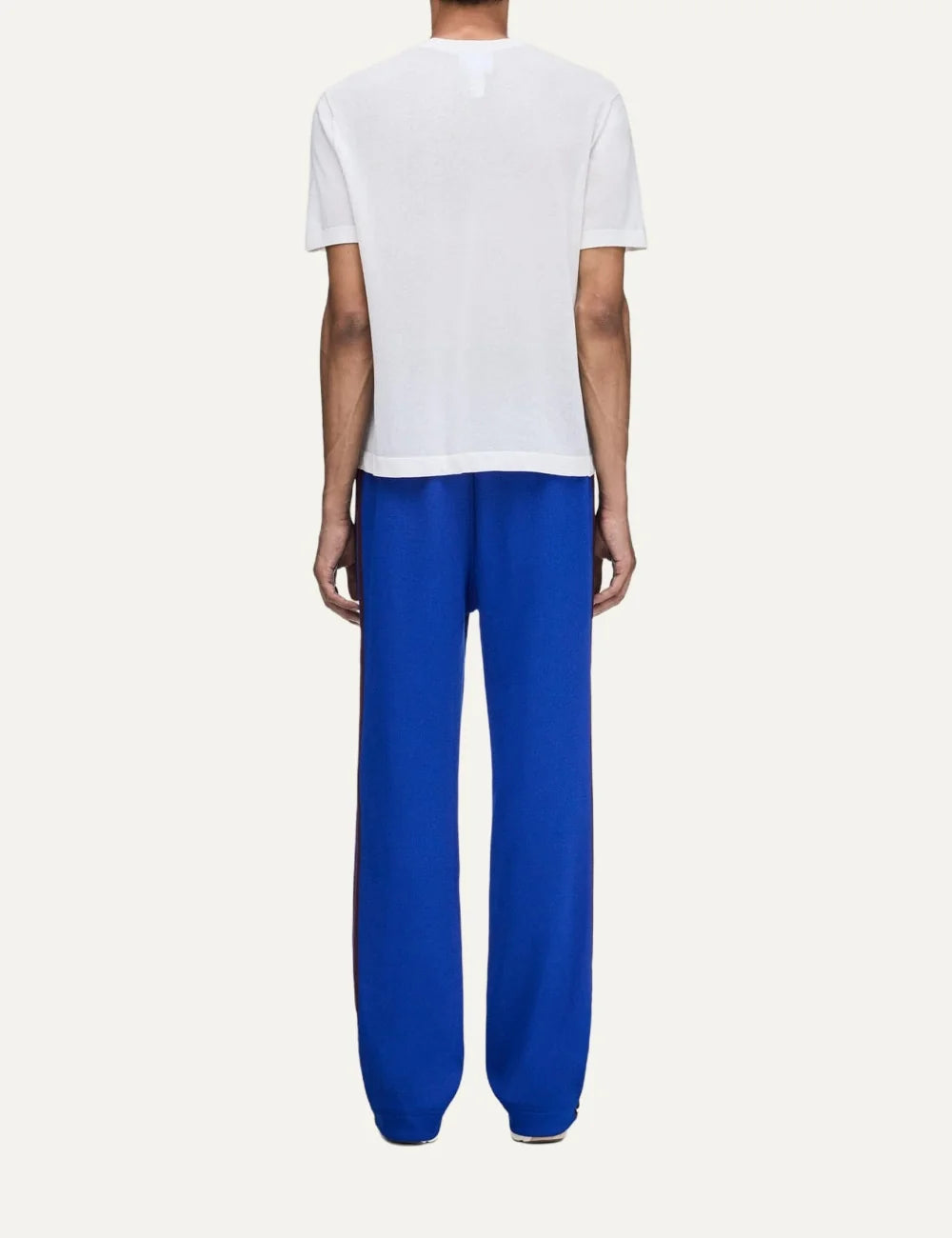 Men's Adidas Originals x Wales Bonner royal blue drop crotch track pants with dark side stripes, straight legs and embroidered Trefoil logo, back view