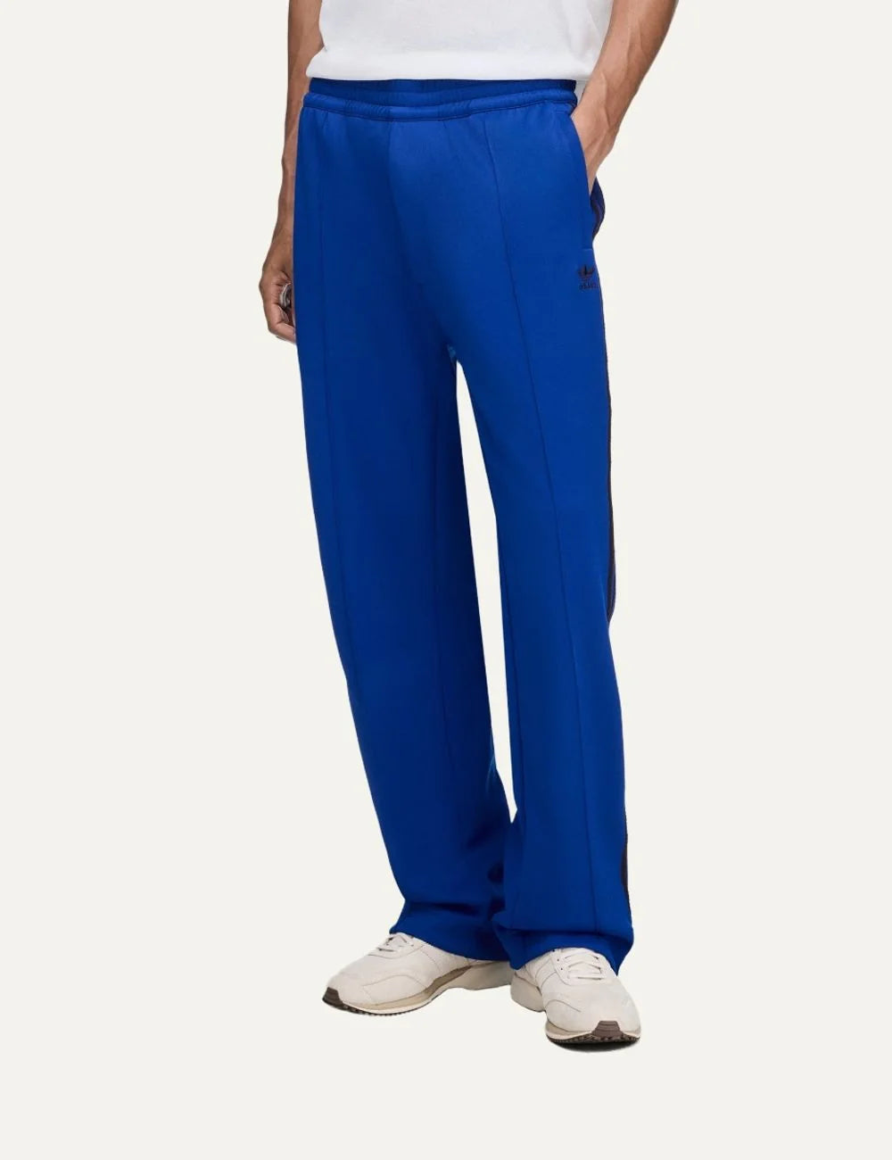 Men's Adidas Originals x Wales Bonner royal blue drop crotch track pants with dark side stripes, straight legs and embroidered Trefoil logo, front view