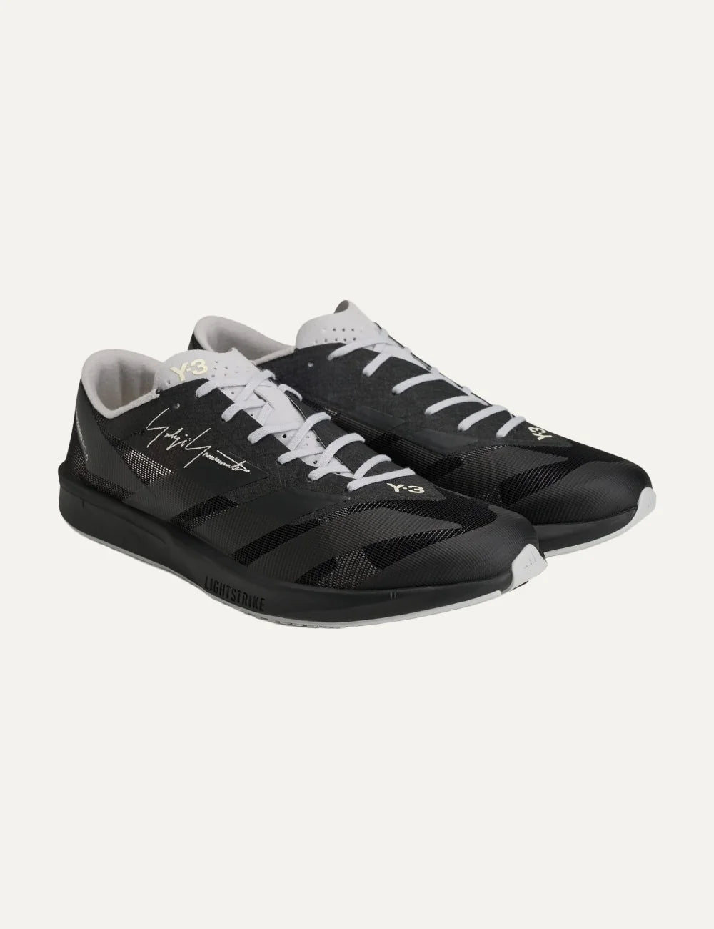 Y-3 men's black textile sneakers with light grey details angled