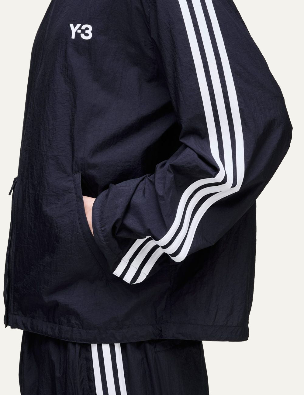 Y-3 black jacket side view three stripes sleeve