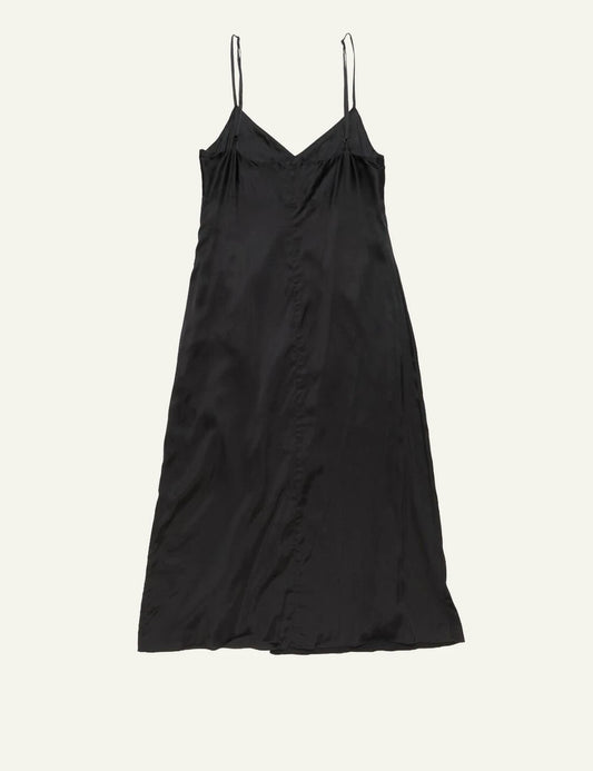Acne Studios black slip dress with thin straps and fluid silhouette front falt view