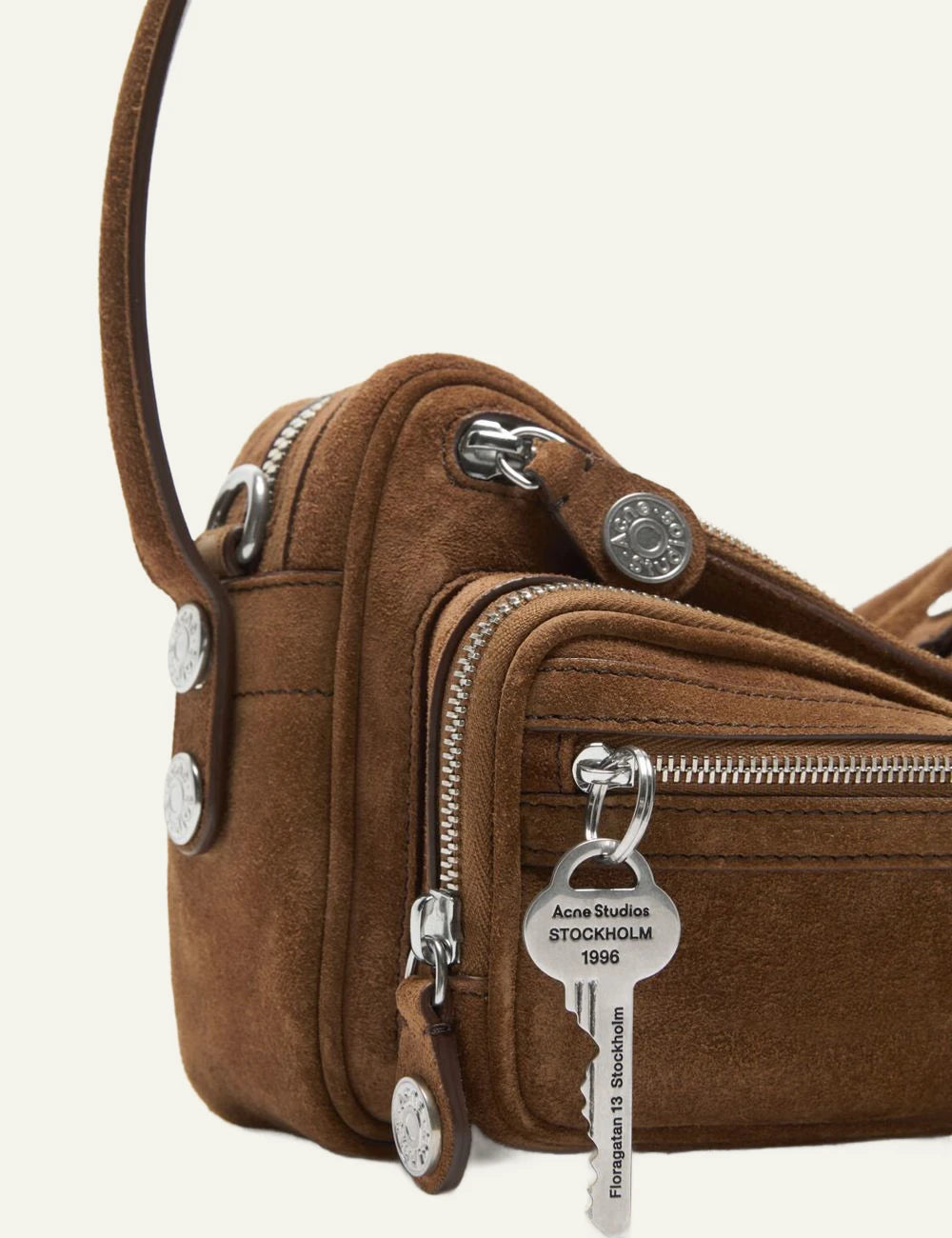 Acne Studios brown suede shoulder bag with multiple zip compartments and silver hardware side flat view