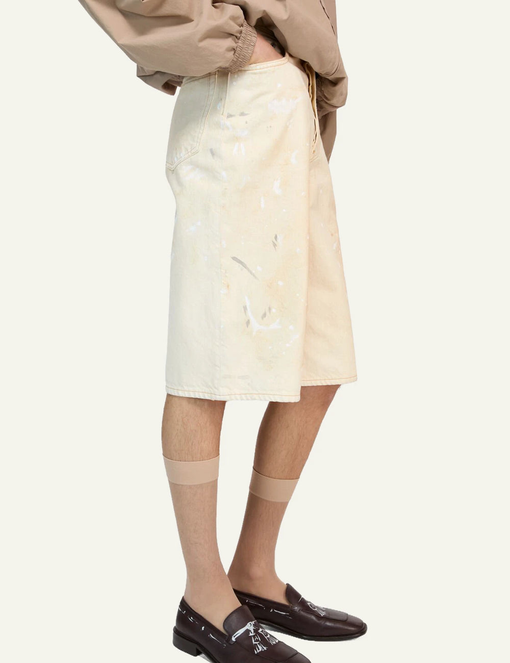 Acne Studios denim shorts ecru dirty wash loose fit below knee side view