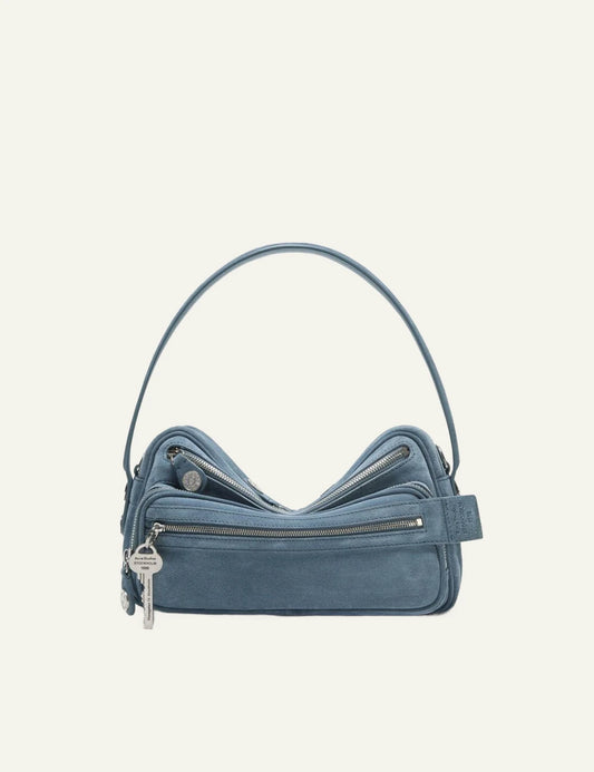 Acne Studios light blue suede shoulder bag with multiple zip pockets and silver-tone hardware front flat view