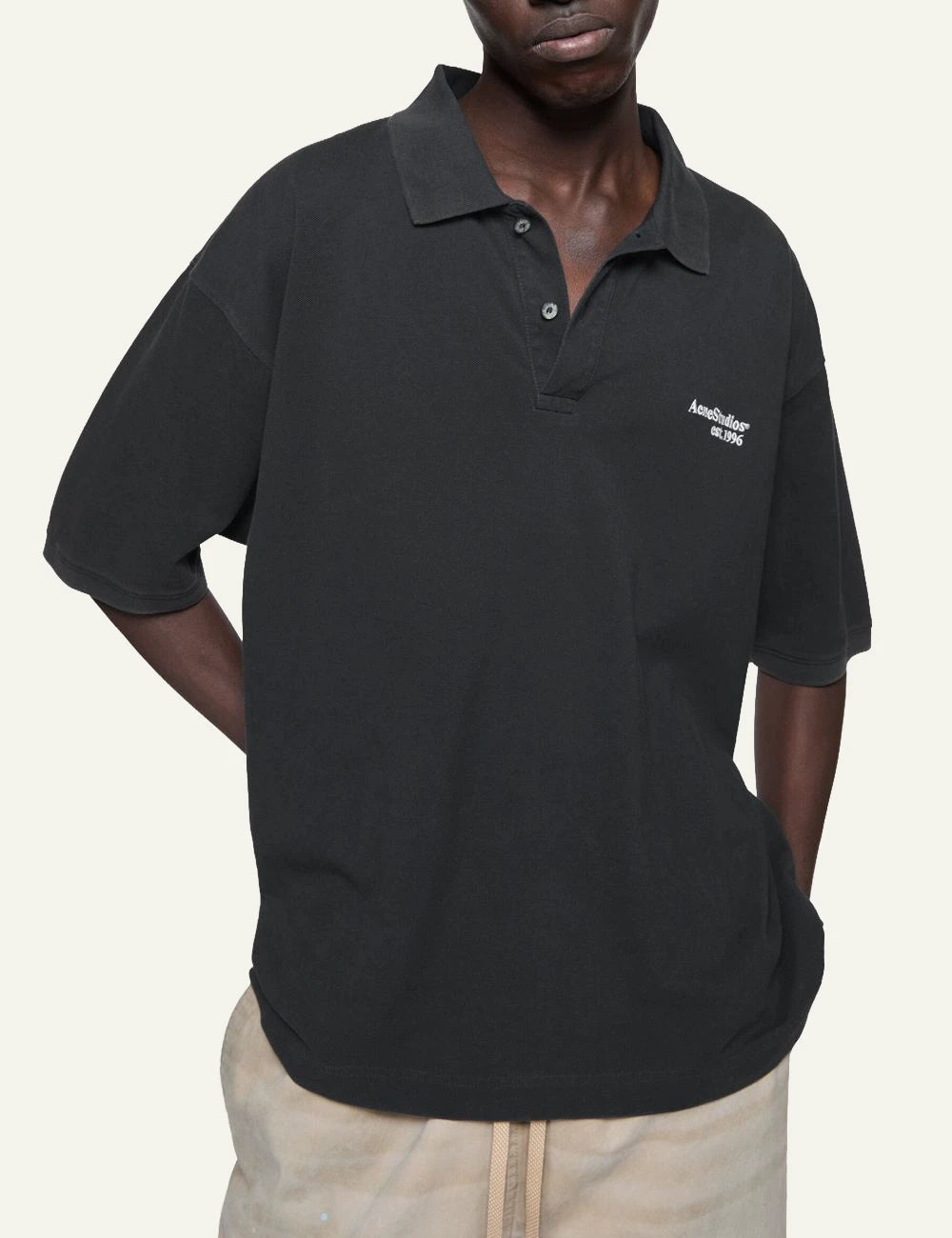 Acne Studios unisex black cotton polo T-shirt with embroidered chest logo model
