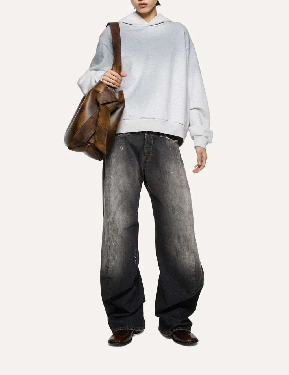 Acne Studios women's 2006F Black Trafalgar jeans in faded black denim with a dirty wash, hand-applied paint splatters, low waist, loose fit and extra-long wide legs full body