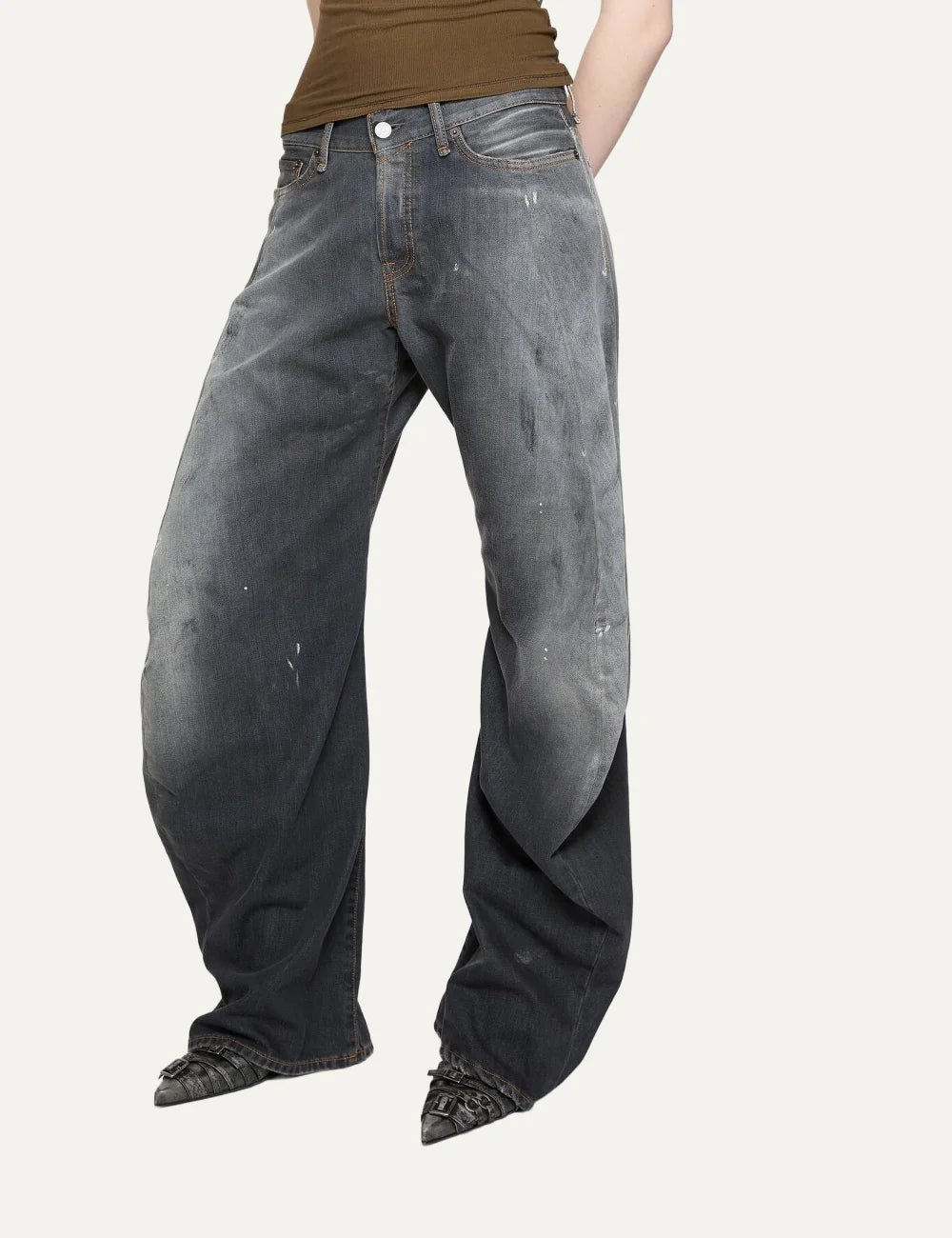 Acne Studios women's 2006F Black Trafalgar jeans in faded black denim with a dirty wash, hand-applied paint splatters, low waist, loose fit and extra-long wide legs side