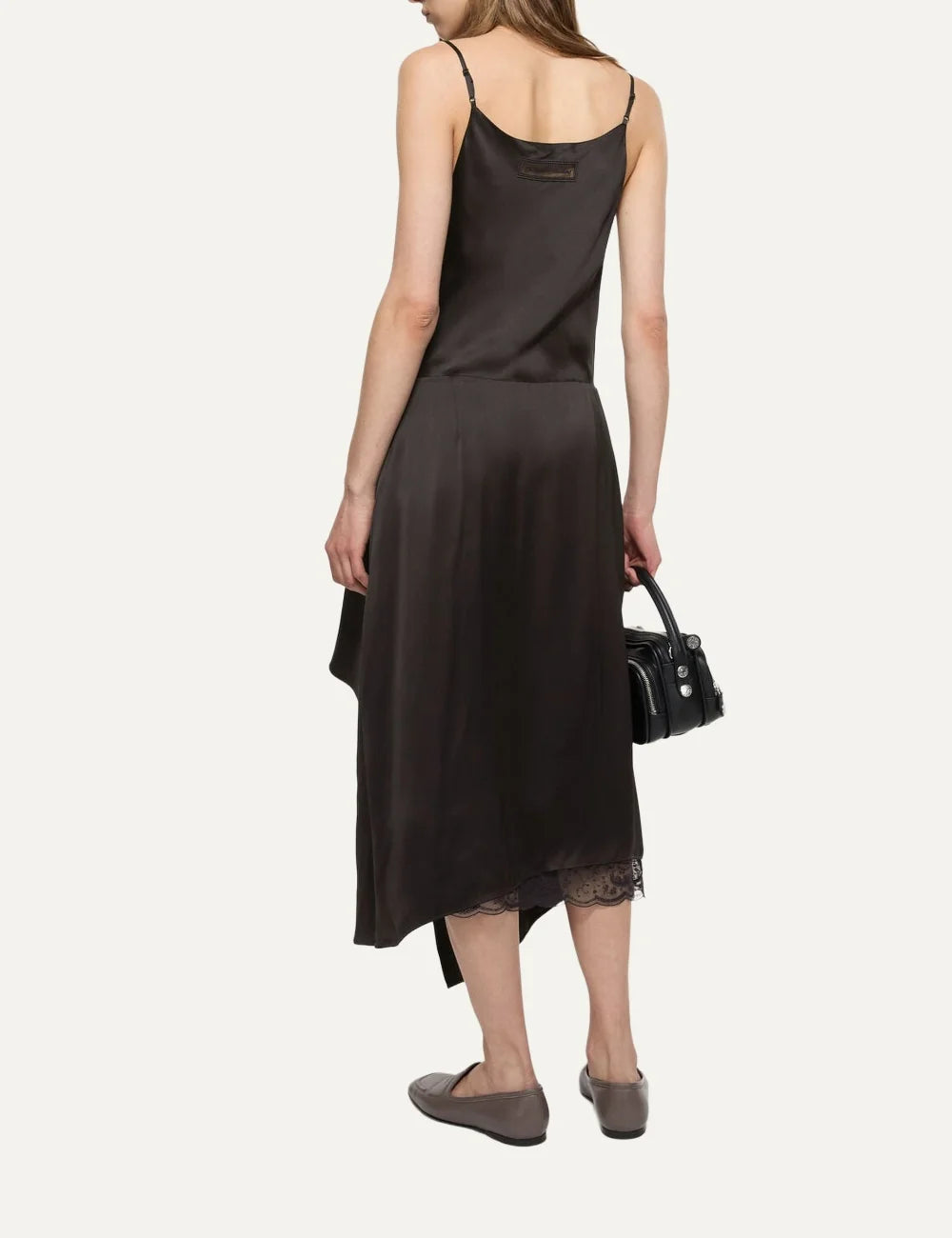 Acne Studios women's dark brown satin midi slip dress with a draped cowl neckline, adjustable spaghetti straps, front ruffled slit and delicate dark brown lace underlayer back