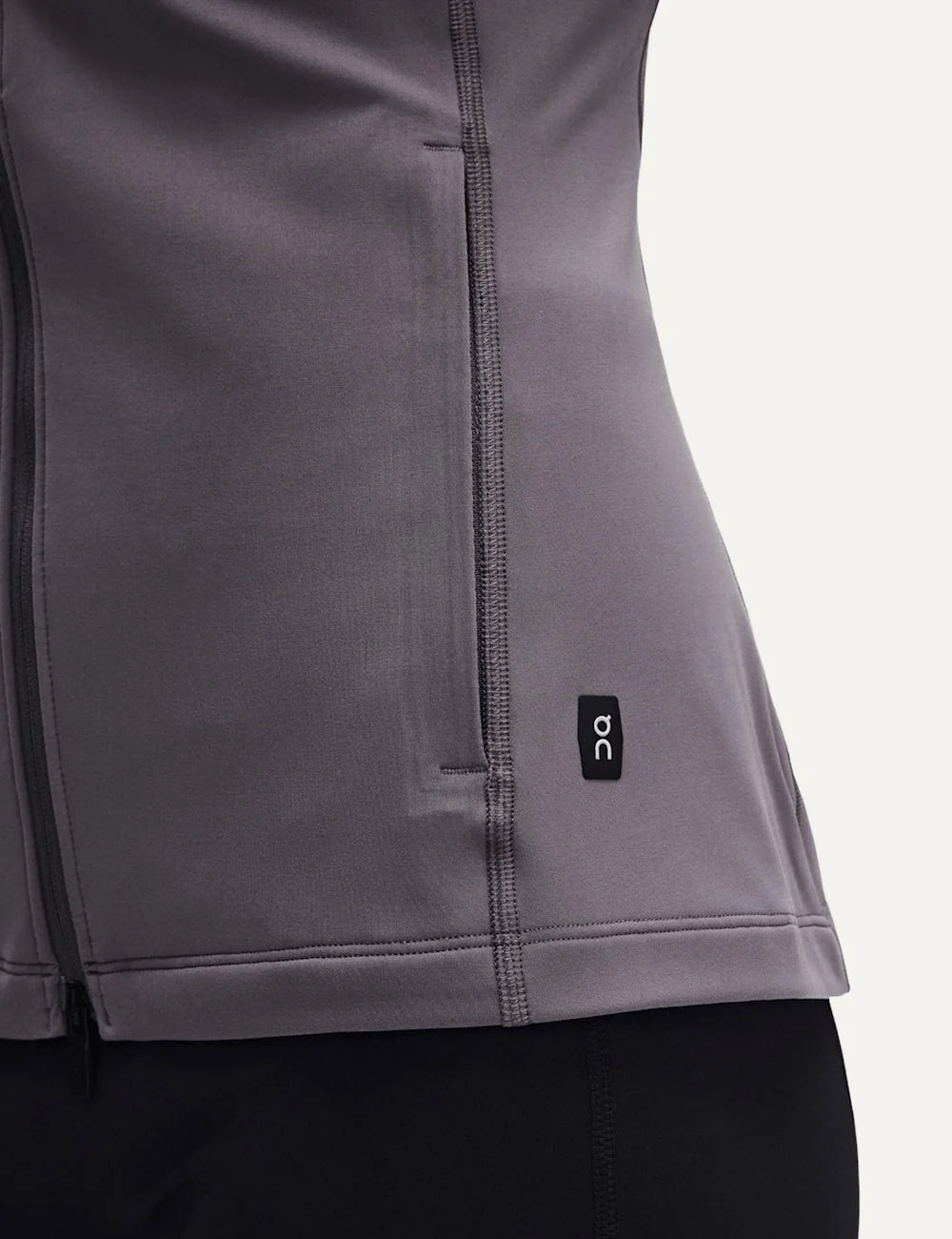 ON women's grey brown soft stretch fitted training jacket with high neck and zip closure detail