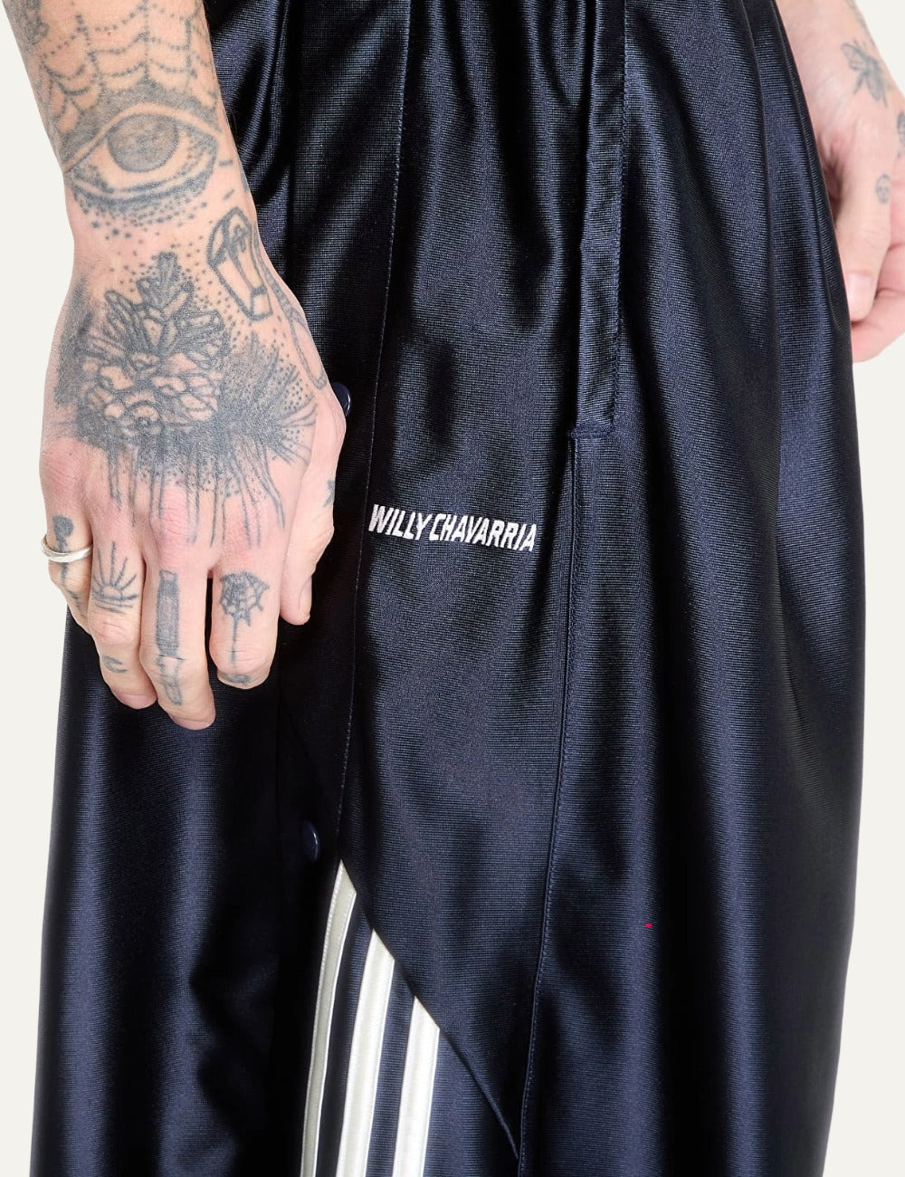 adidas Originals x Willy Chavarria men satin pants details stripes view athletic streetwear